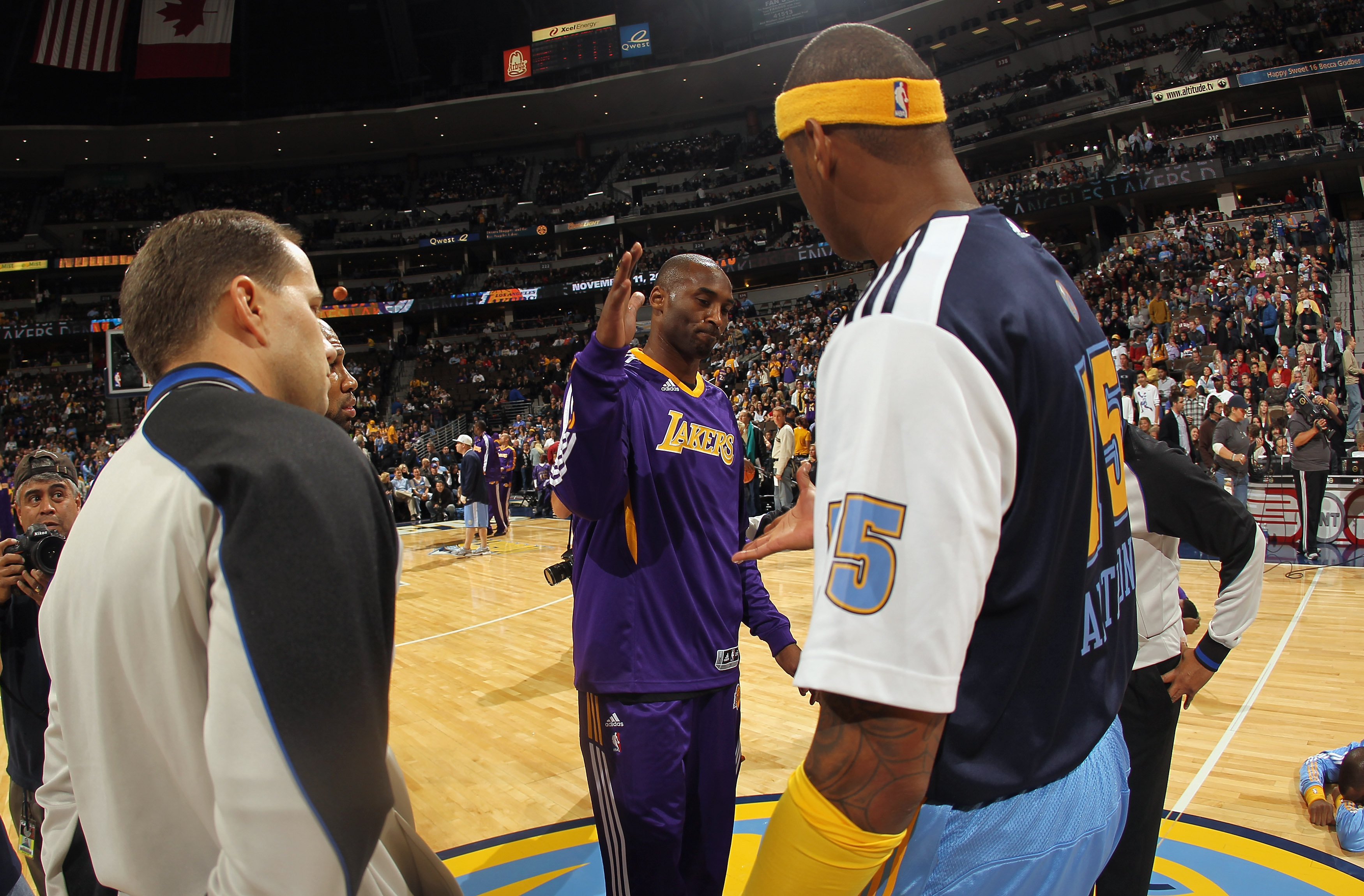 DENVER - NOVEMBER 11:  Carmelo Anthony #15 of the Denver Nuggets and Kobe Bryant #24 of the Los Angeles Lakers meet at mid court prior to the game at the Pepsi Center on November 11, 2010 in Denver, Colorado. The Nuggets defeated the Lakers 118-112.  NOTE