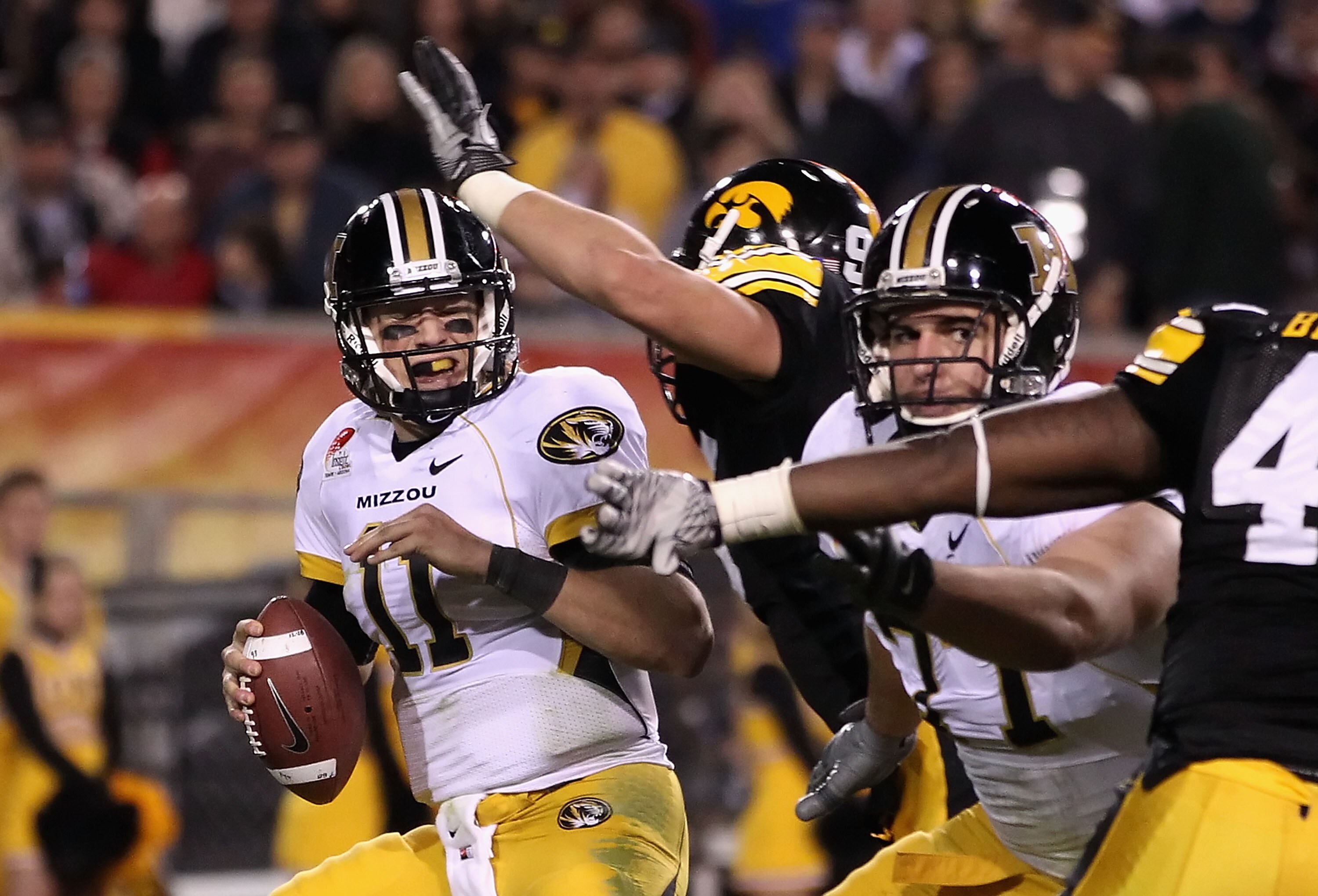 TEMPE, AZ - DECEMBER 28:  Quarterback Blaine Gabbert #11 of the Missouri Tigers is sacked by Karl Klug #95 of the Iowa Hawkeyes during the Insight Bowl at Sun Devil Stadium on December 28, 2010 in Tempe, Arizona.  (Photo by Christian Petersen/Getty Images