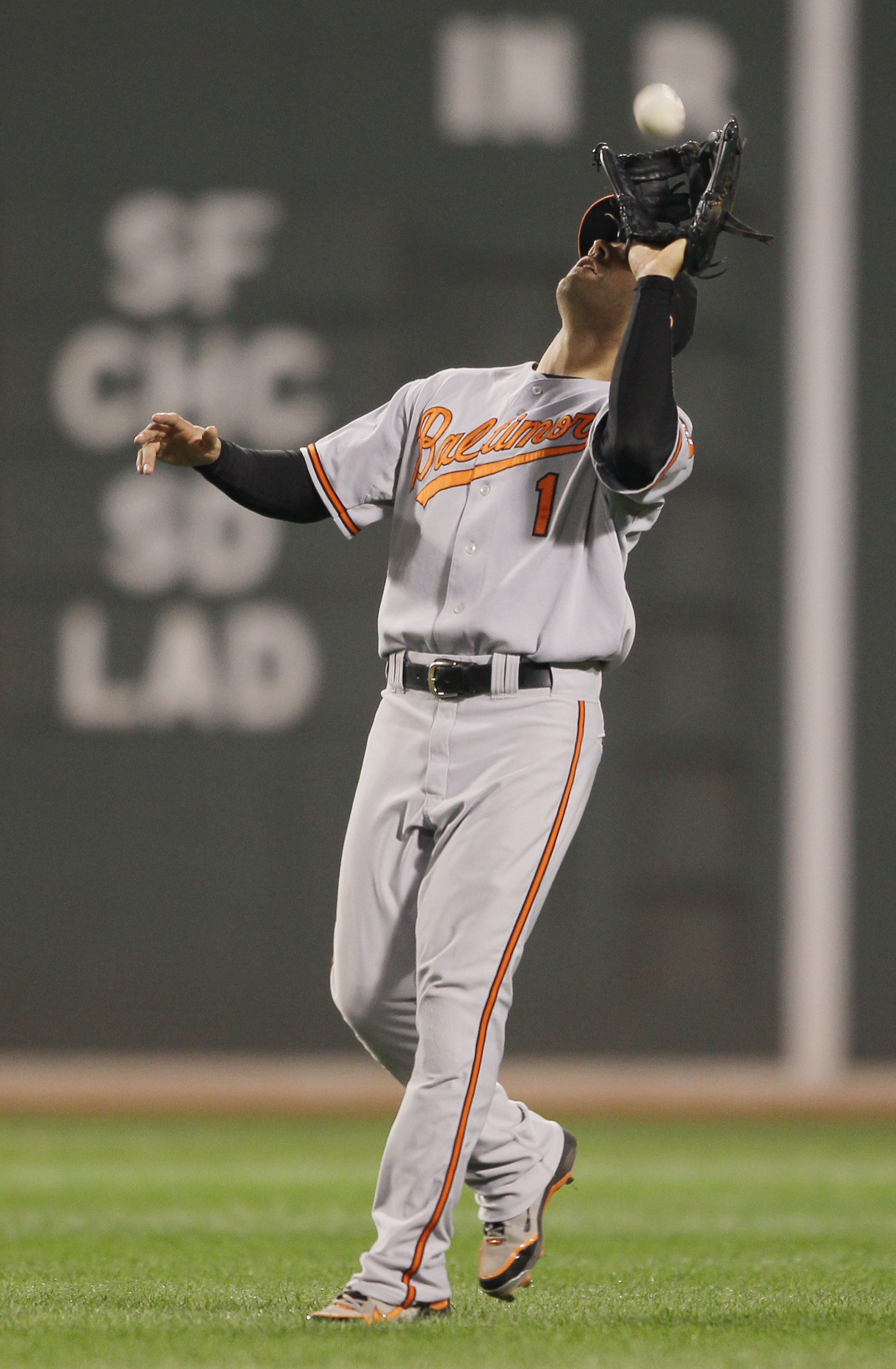 BOSTON - SEPTEMBER 22:  Brian Roberts #1 of the Baltimore Orioles makes the catch for the against the Boston Red Sox on September 22, 2010 at Fenway Park in Boston, Massachusetts.  (Photo by Elsa/Getty Images)