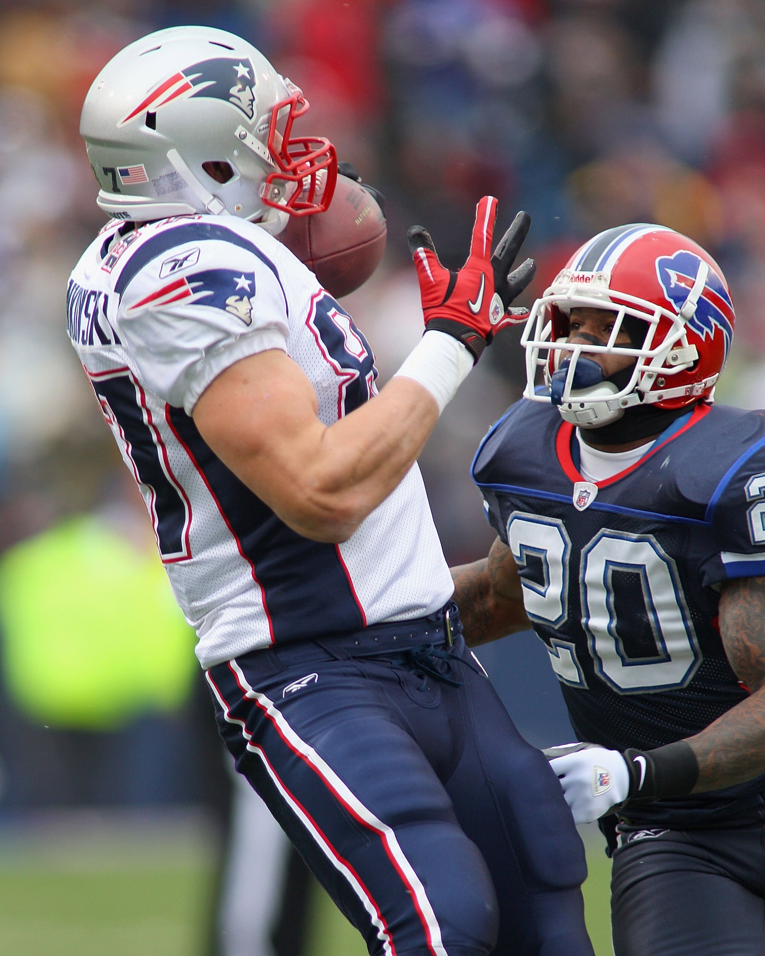 ORCHARD PARK, NY - DECEMBER 26:  Rob Gronkowski, #87 of the New England Patriots makes a catch against Donte Whitner #20 of the Buffalo Bills at Ralph Wilson Stadium on December 26, 2010 in Orchard Park, New York.  (Photo by Rick Stewart/Getty Images)