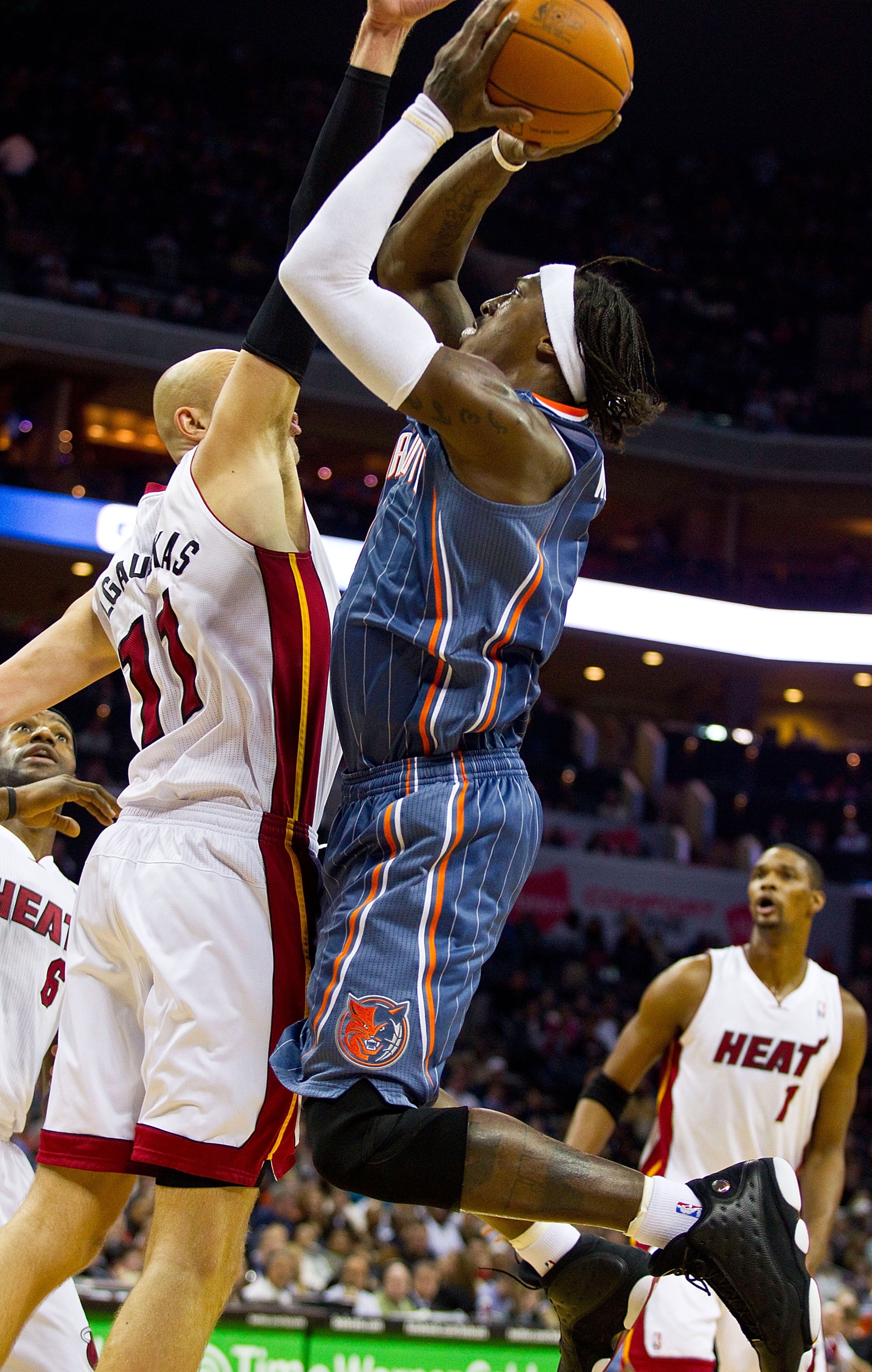 CHARLOTTE, NC - FEBRUARY 04: Gerald Wallace #3 of the Charlotte Bobcats shoots over Zydrunas Ilgauskus #11 of the Miami Heat at the Time Warner Cable Arena on February 4, 2011 in Charlotte, North Carolina. The Heat defeated the Bobcats 109-97. NOTE TO CHARLOTTE, NC - FEBRUARY 04: Gerald Wallace #3 of the Charlotte Bobcats shoots over Zydrunas Ilgauskus #11 of the Miami Heat at the Time Warner Cable Arena on February 4, 2011 in Charlotte, North Carolina. The Heat defeated the Bobcats 109-97. NOTE TO