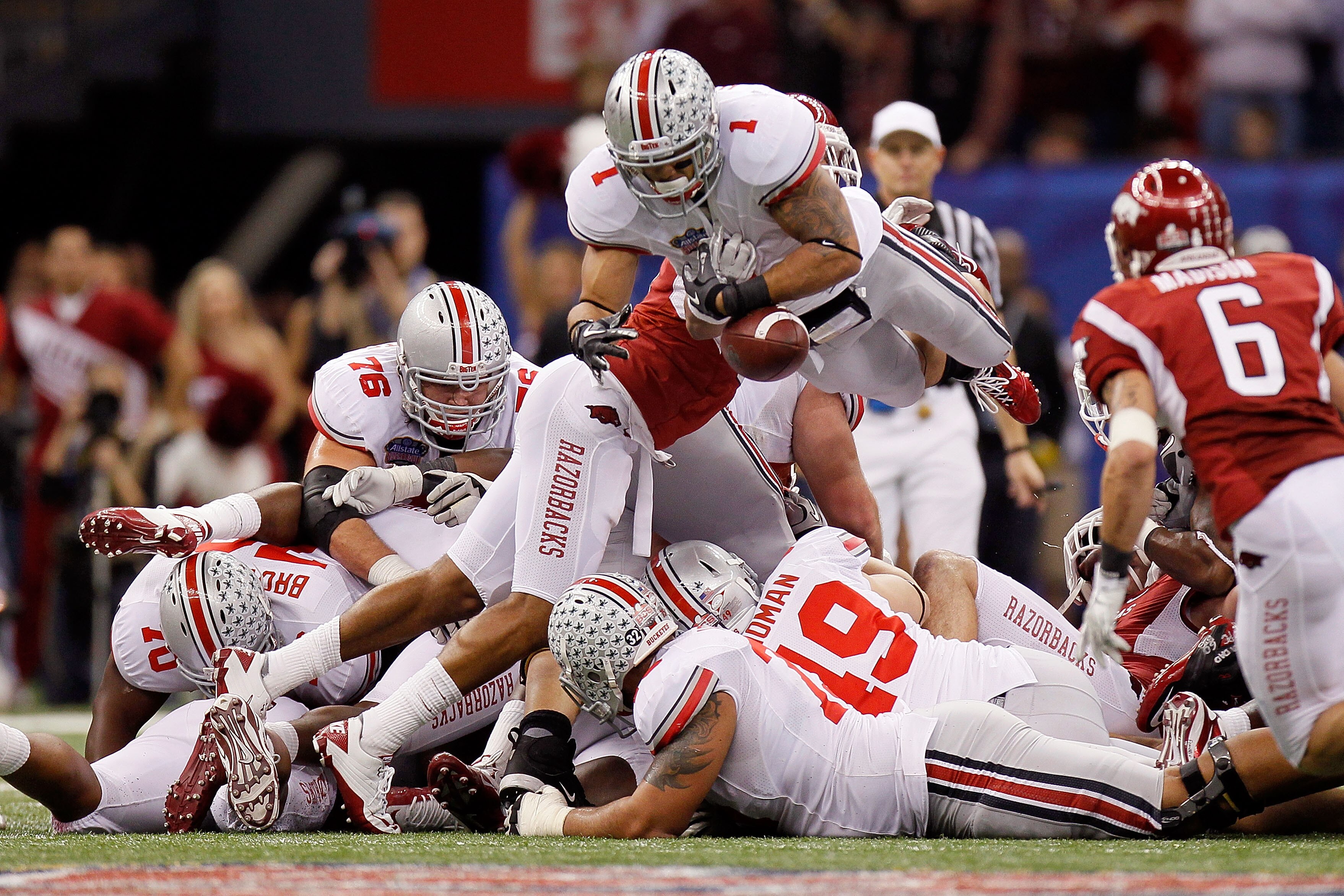 NEW ORLEANS, LA - JANUARY 04:  Dan Herron #1 of the Ohio State Buckeyes fumbles the football in the fourth quarter agianst the Arkansas Razorbacks during the Allstate Sugar Bowl at the Louisiana Superdome on January 4, 2011 in New Orleans, Louisiana.  (Ph