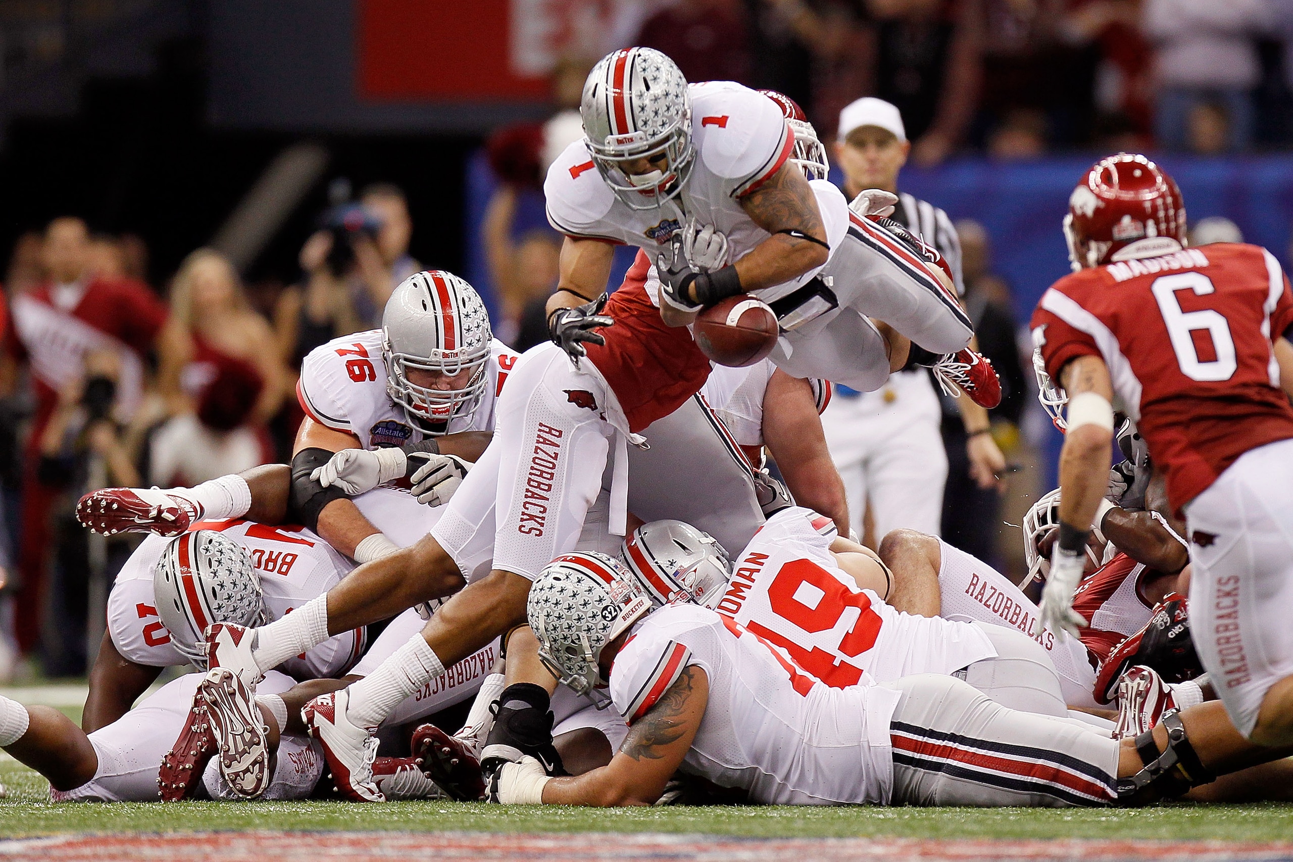 NEW ORLEANS, LA - JANUARY 04:  Dan Herron #1 of the Ohio State Buckeyes fumbles the football in the fourth quarter agianst the Arkansas Razorbacks during the Allstate Sugar Bowl at the Louisiana Superdome on January 4, 2011 in New Orleans, Louisiana.  (Ph