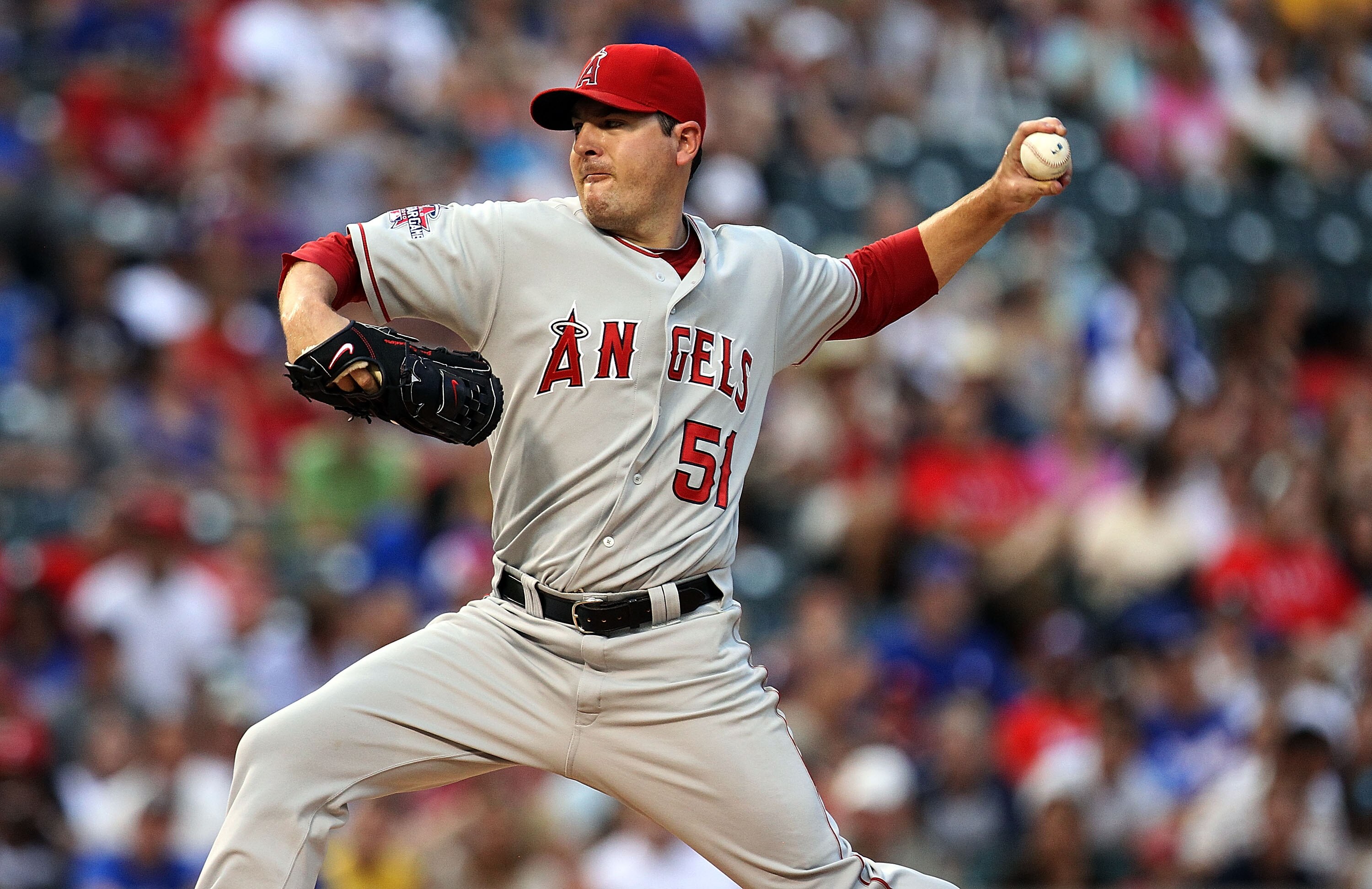 ARLINGTON, TX - JULY 23:  Pitcher Joe Saunders #51 of the Los Angeles Angels of Anaheim throws against the Texas Rangers on July 23, 2010 at Rangers Ballpark in Arlington, Texas.  (Photo by Ronald Martinez/Getty Images)