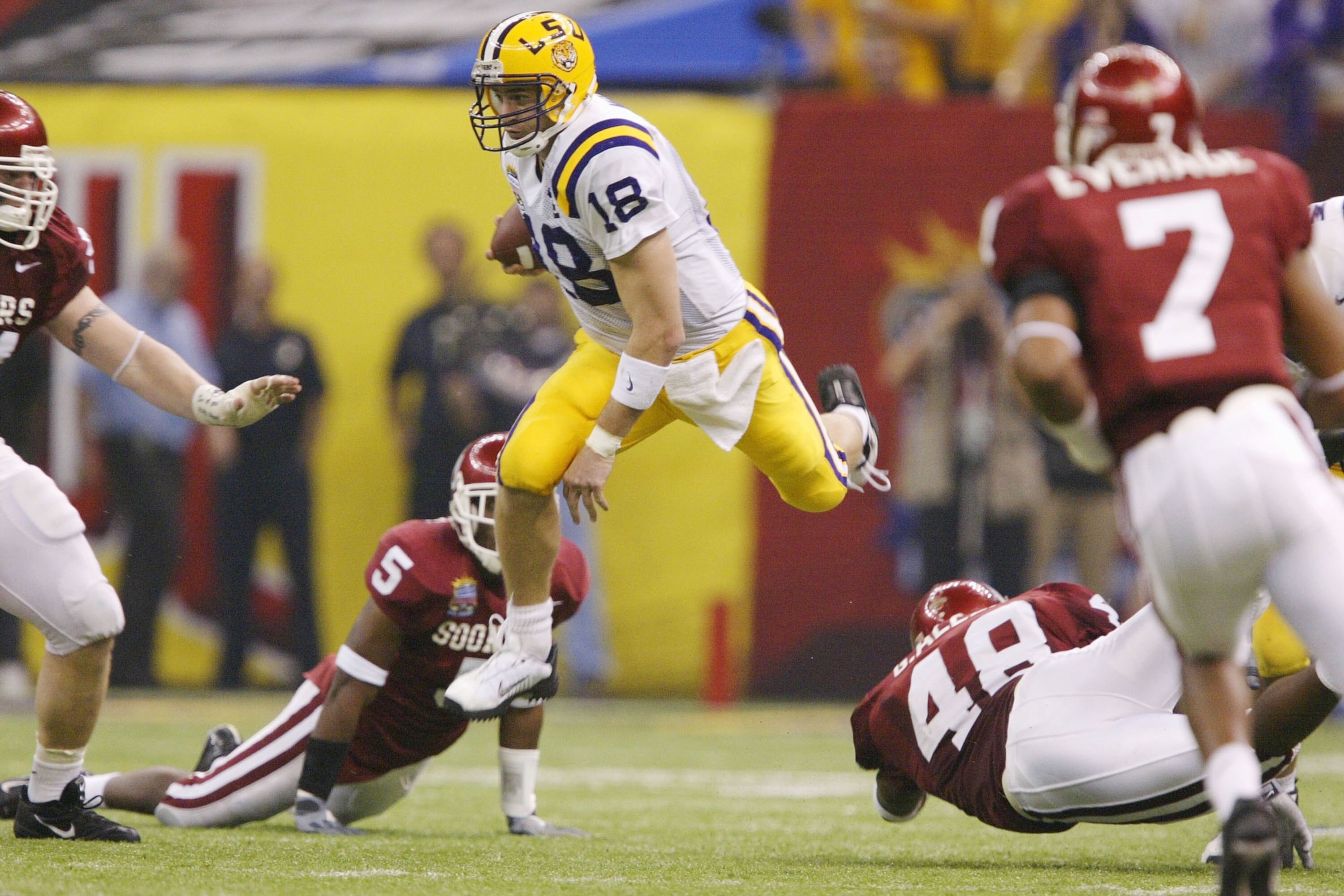 NEW ORLEANS - JANUARY 4:  Quarterback Matt Mauck #18 of LSU scrambles around the Oklahoma defense in the third quarter during the Nokia Sugar Bowl National Championship game on January 4, 2004 at the Louisiana Superdome in New Orleans, Louisiana.  (Photo 