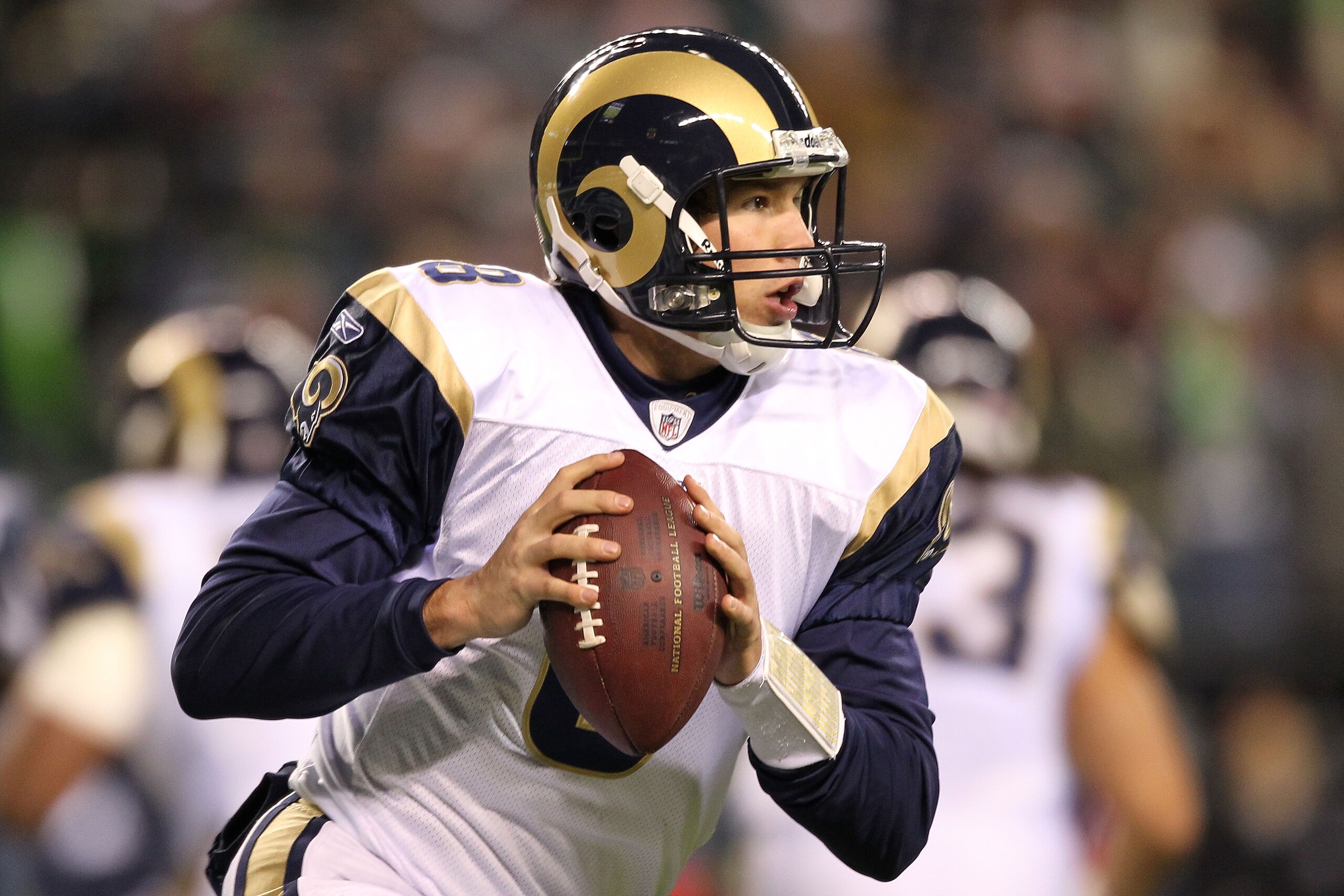 SEATTLE, WA - JANUARY 02:  Quarterback Sam Bradford #8 of the St. Louis Rams looks to pass against the Seattle Seahawks during their game at Qwest Field on January 2, 2011 in Seattle, Washington.  (Photo by Otto Greule Jr/Getty Images)