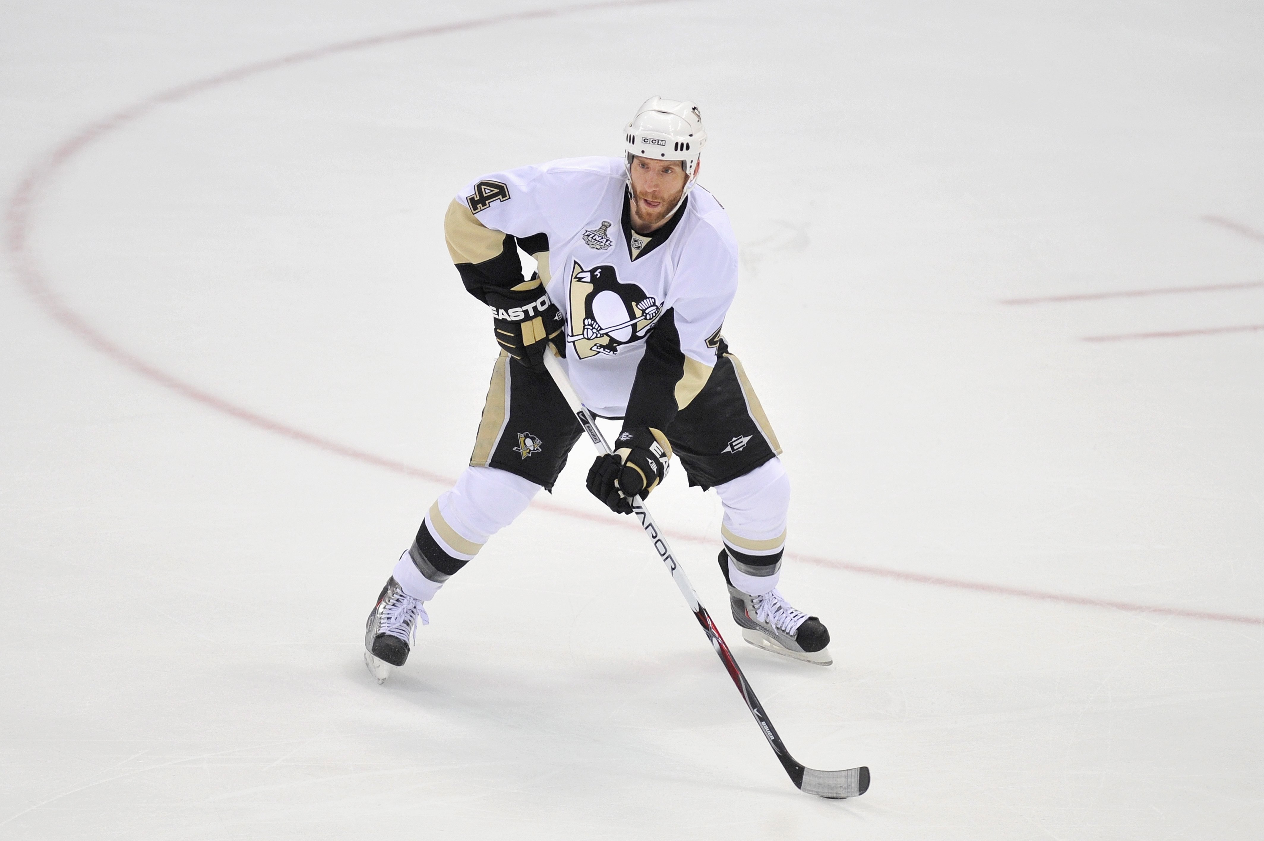 DETROIT - JUNE 12:  Rob Scuderi #4 of the Pittsburgh Penguins handles the puck against the Detroit Red Wings during Game Seven of the 2009 NHL Stanley Cup Finals at Joe Louis Arena on June 12, 2009 in Detroit, Michigan. (Photo by Jamie Sabau/Getty Images)