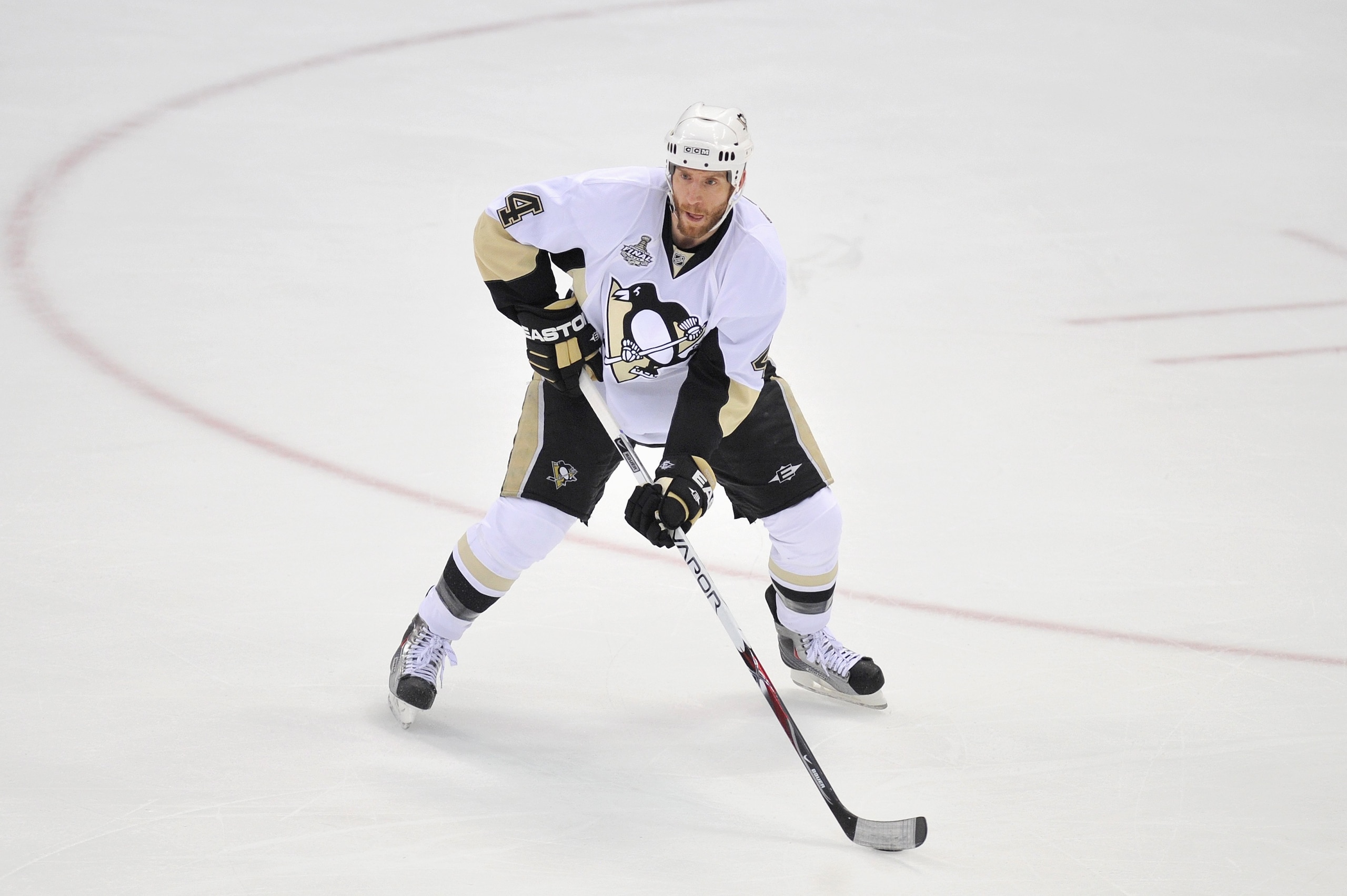 DETROIT - JUNE 12:  Rob Scuderi #4 of the Pittsburgh Penguins handles the puck against the Detroit Red Wings during Game Seven of the 2009 NHL Stanley Cup Finals at Joe Louis Arena on June 12, 2009 in Detroit, Michigan. (Photo by Jamie Sabau/Getty Images)