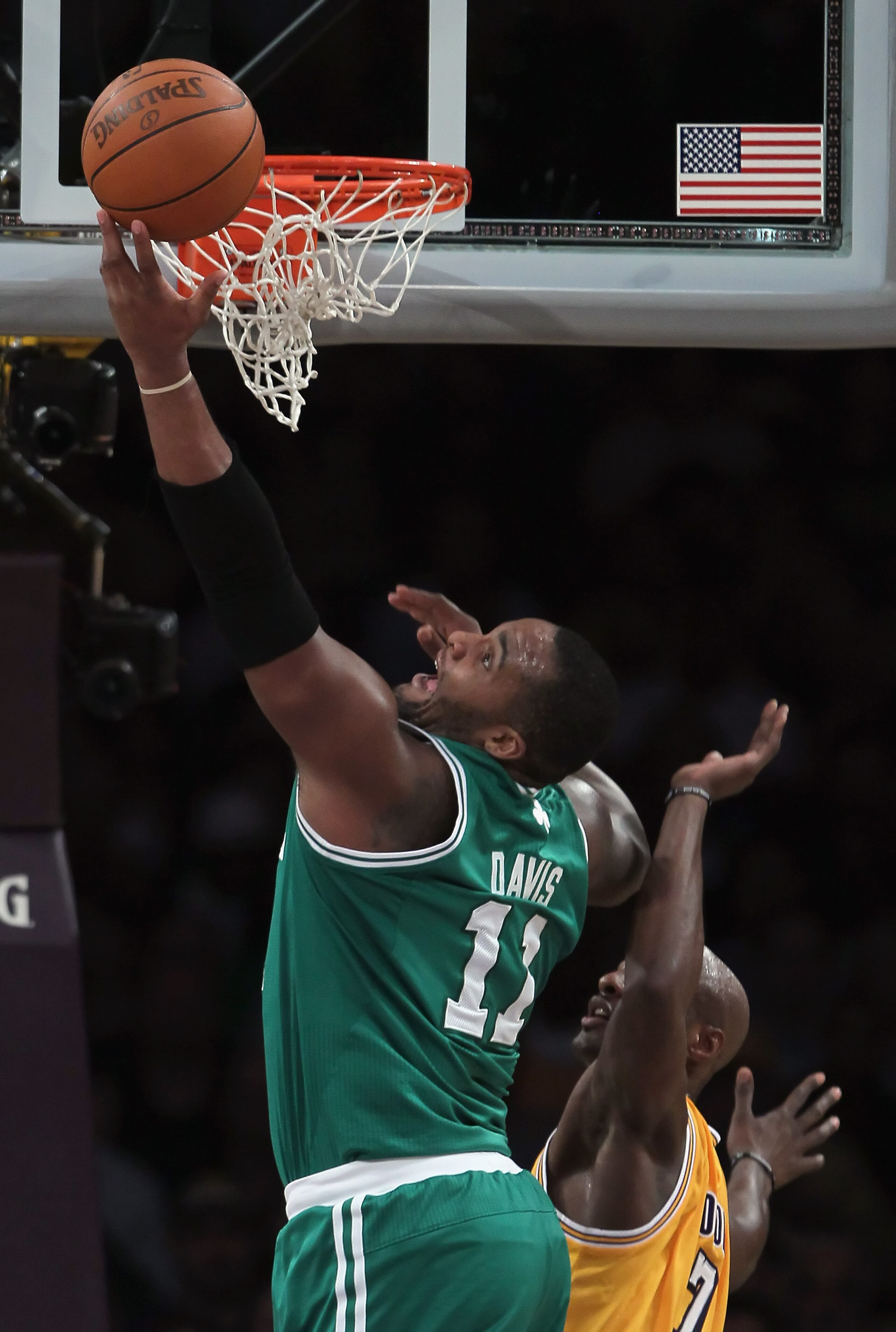 LOS ANGELES, CA - JANUARY 30:  Glen Davis #11 of the Boston Celtics drives to the basket past Lamar Odom #7 of the Los Angeles Lakers in the first half at Staples Center on January 30, 2011 in Los Angeles, California. The Celtics defeated the Lakers 109-9
