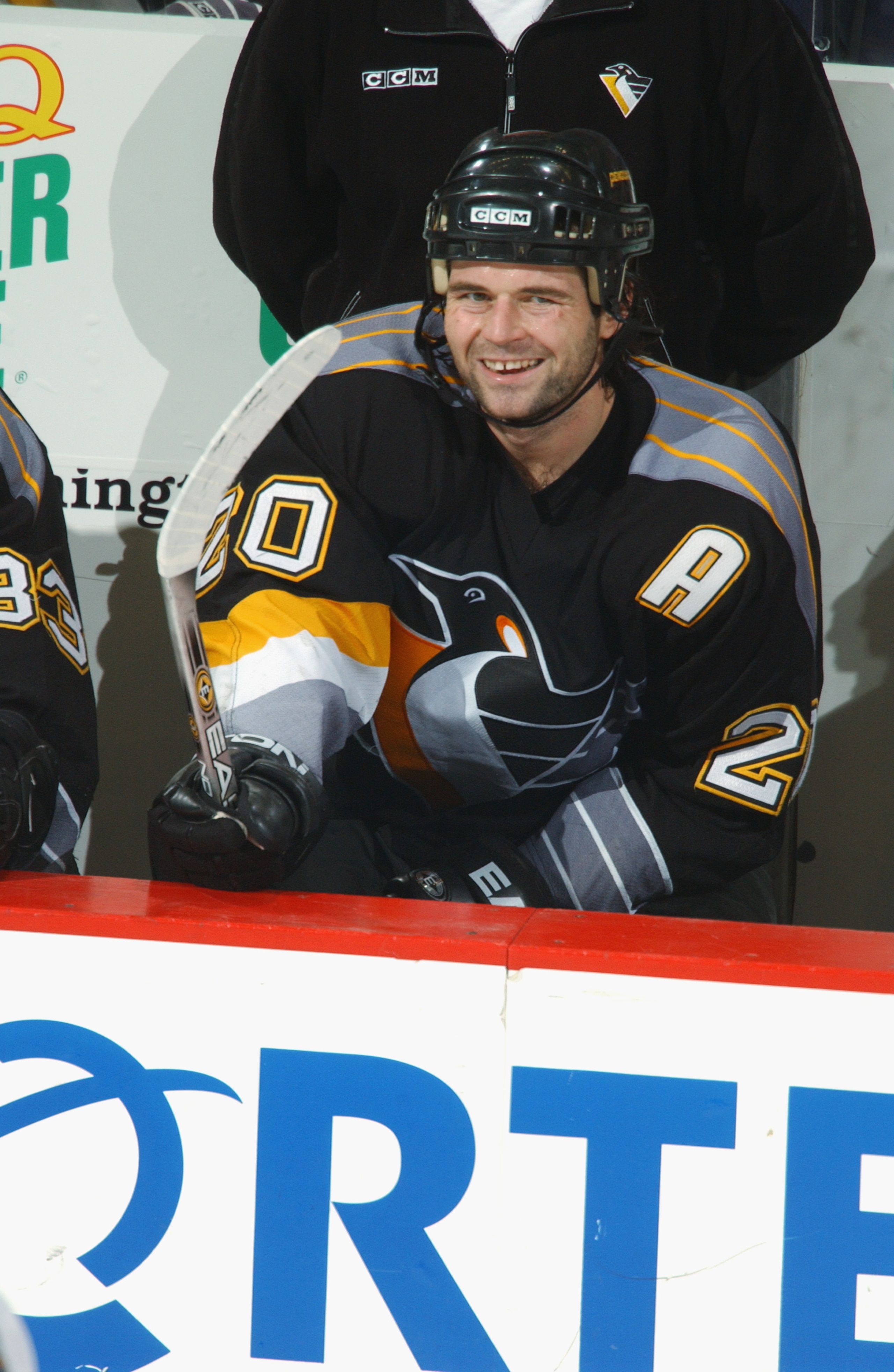 WASHINGTON - DECEMBER 22:  Centre Robert Lang #20 of the Pittsburgh Penguins smiles in the players' box during the NHL game against the Washington Capitals at the MCI Center in Washington D.C. on December 22, 2001.  The Penguins tied the Capitals 4-4.  (P