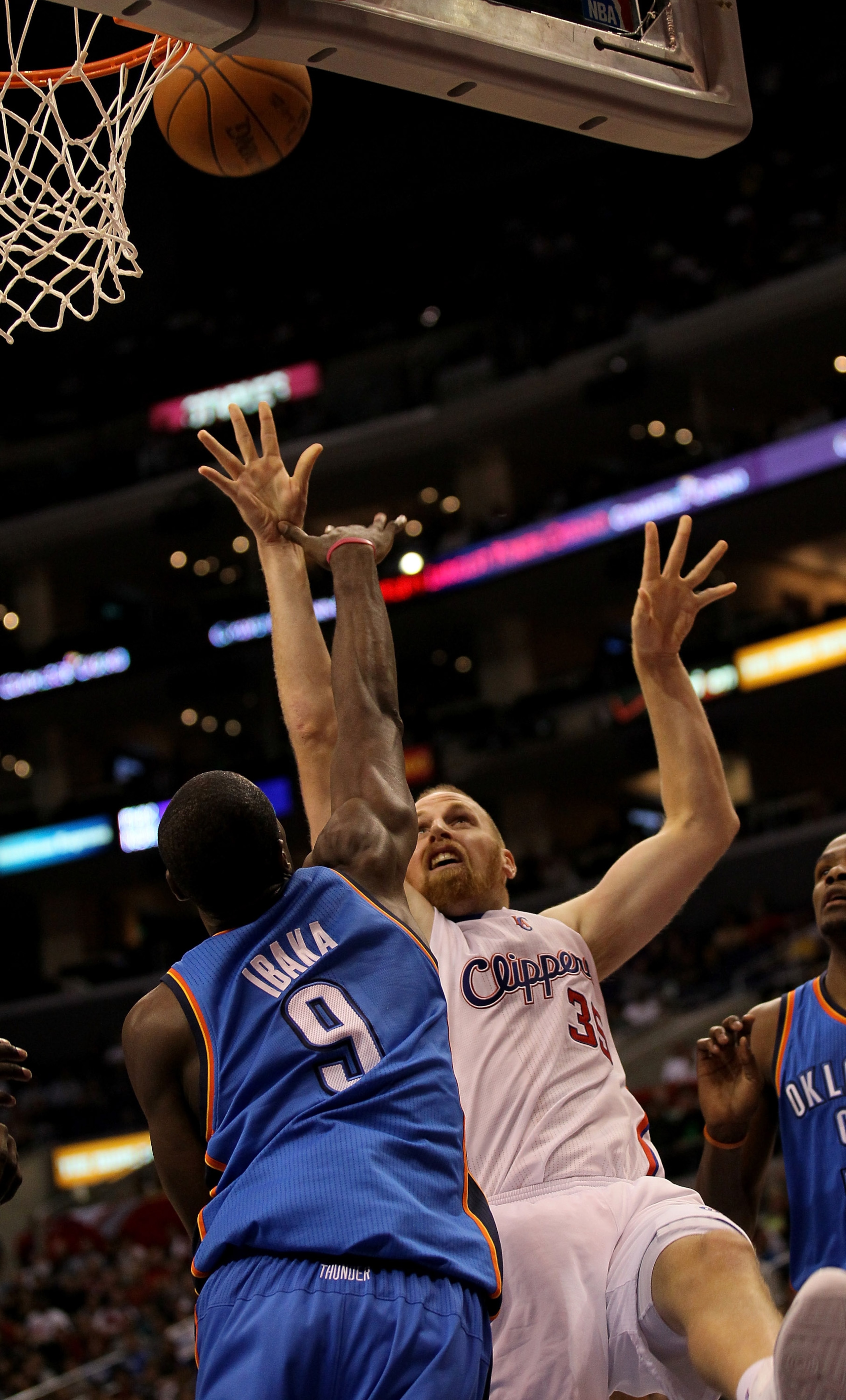 LOS ANGELES, CA - NOVEMBER 03:  Chris Kaman #35 of the Los Angeles Clippers shoots over Serge Ibaka #9 of the Oklahoma City Thunder at Staples Center on November 3, 2010 in Los Angeles, California. The Clippers won 107-92.  NOTE TO USER: User expressly ac
