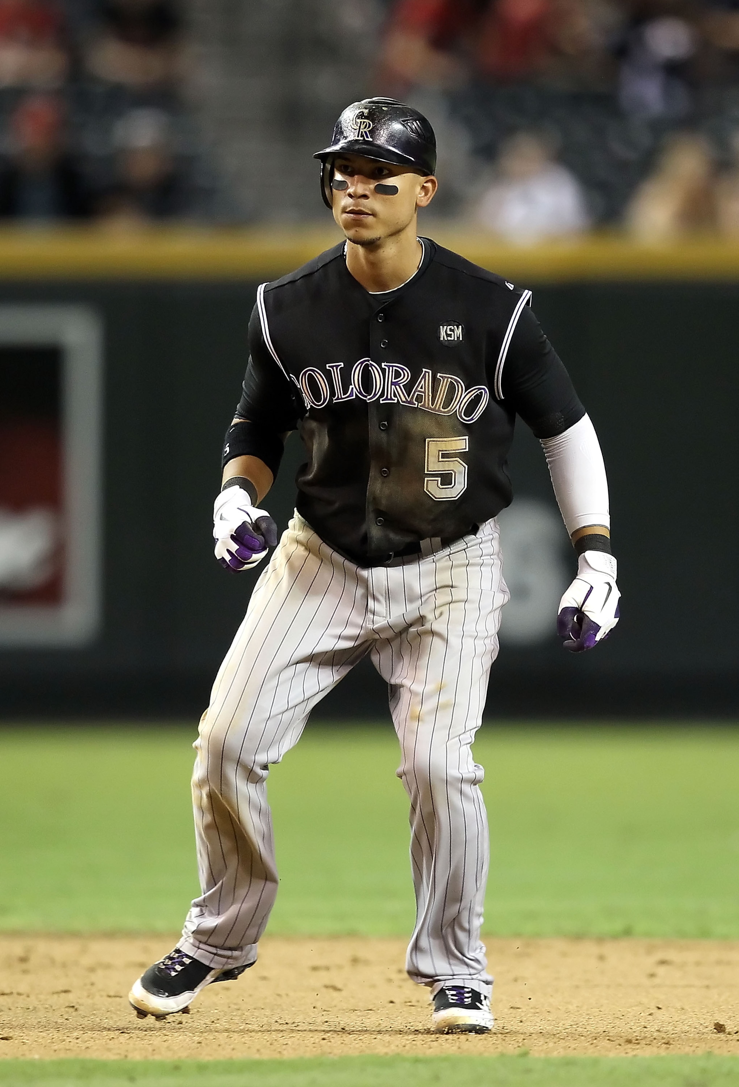 PHOENIX - SEPTEMBER 22:  Carlos Gonzalez #5 of the Colorado Rockies leads off second base during the Major League Baseball game against the Arizona Diamondbacks at Chase Field on September 22, 2010 in Phoenix, Arizona.  (Photo by Christian Petersen/Getty