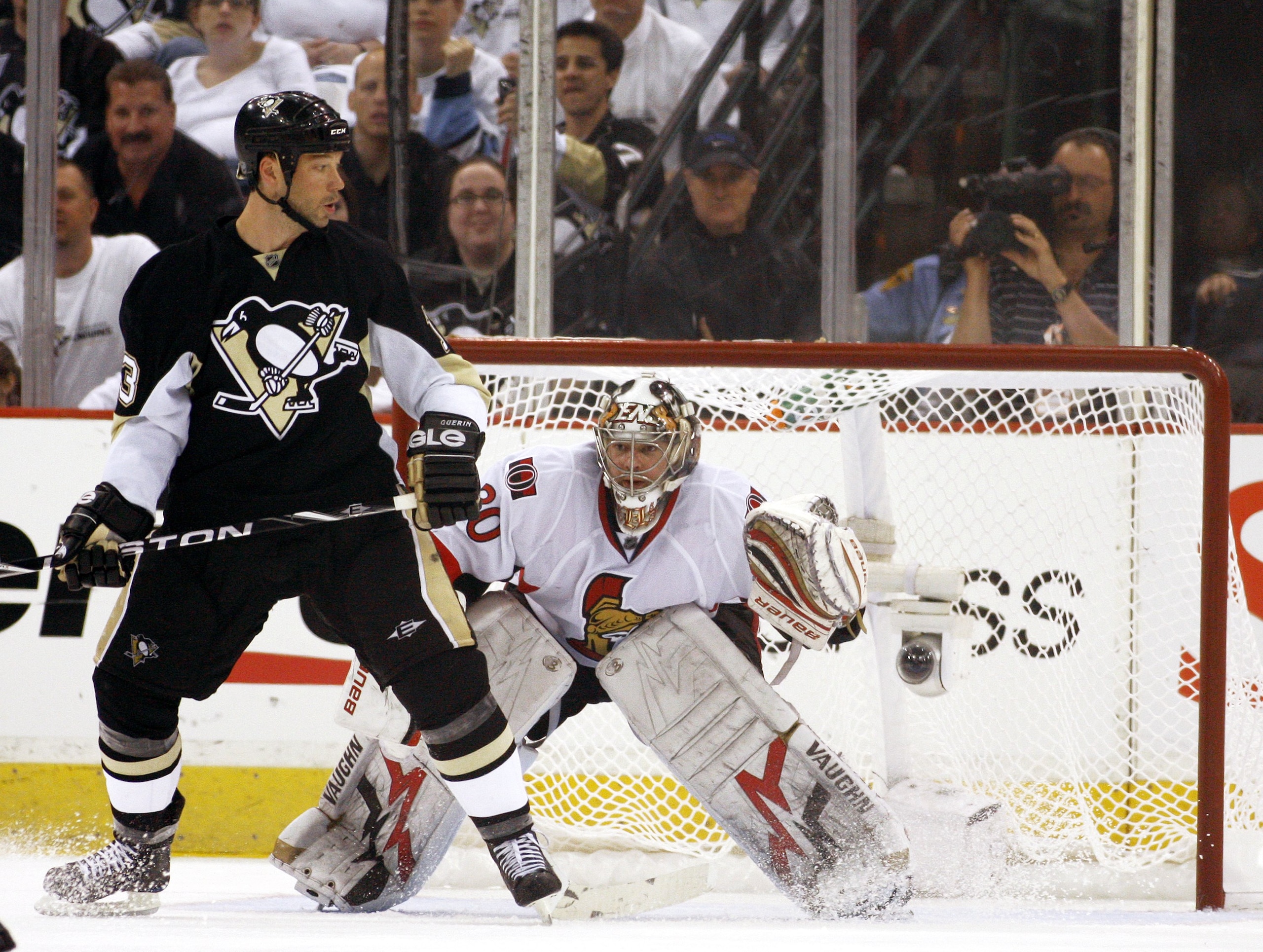 PITTSBURGH - APRIL 16:  Brian Elliott #30 of the Ottawa Senators protects the net as Bill Guerin #13 of the Pittsburgh Penguins sets up in front in Game Two of the Eastern Conference Quarterfinals during the 2010 NHL Stanley Cup Playoffs at Mellon Arena o