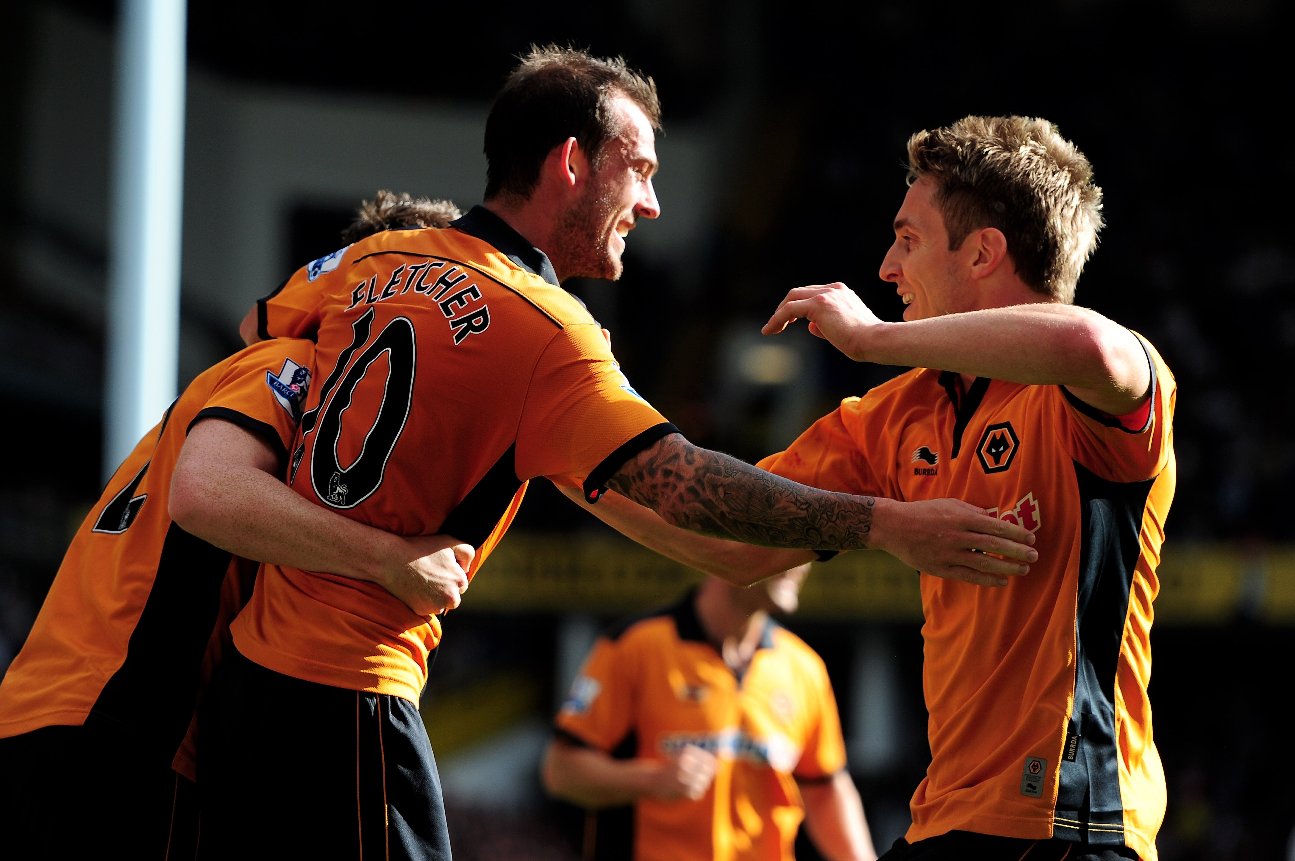 LONDON, ENGLAND - SEPTEMBER 18:  Steven Fletcher (L) of Wolves is congratulated by teammate Kevin Doyle after scoring the opening goal during the Barclays Premier League match between Tottenham Hotspur and Wolverhampton Wanderers at White Hart Lane on Sep