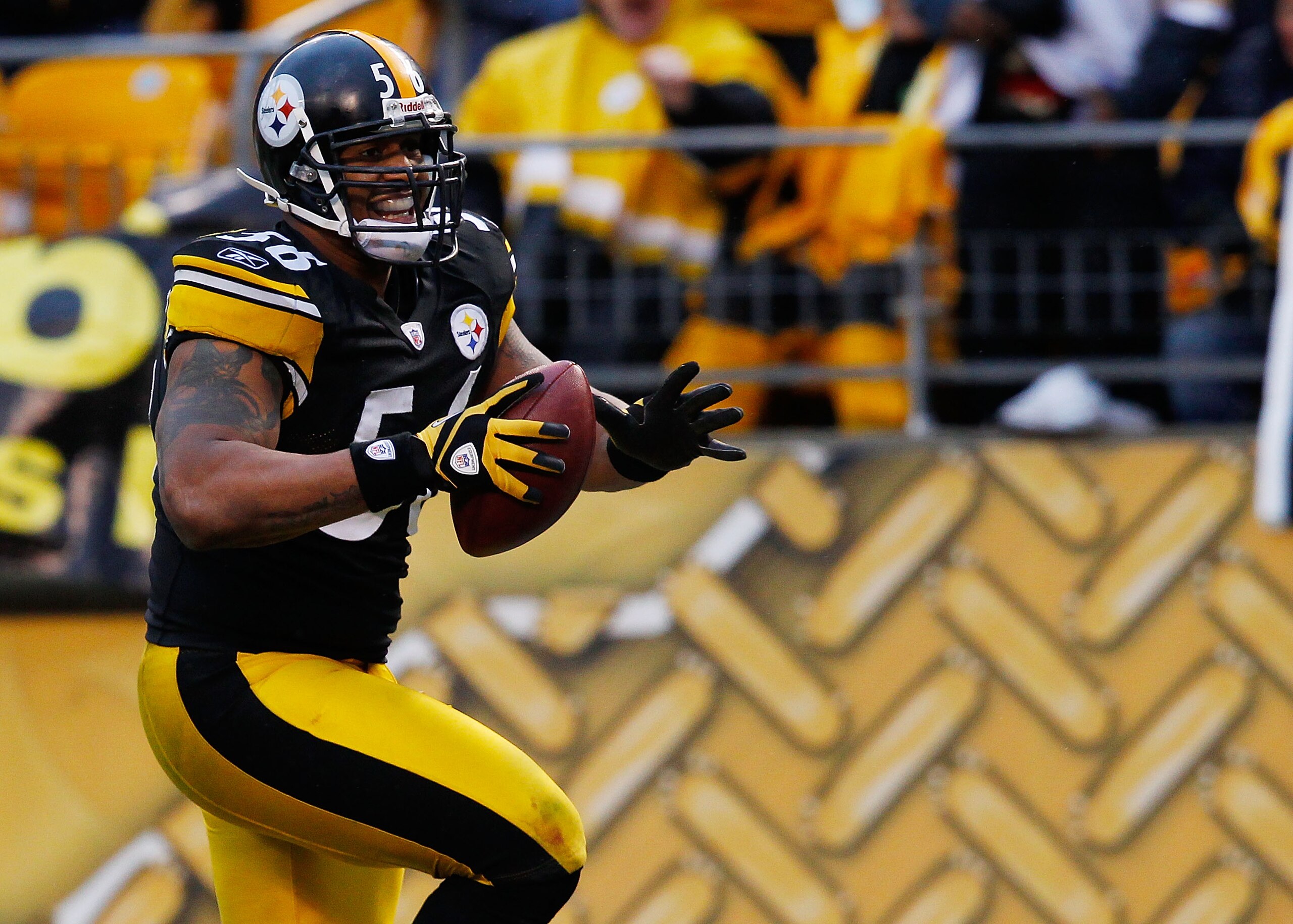PITTSBURGH - DECEMBER 12:  LaMarr Woodley #56 of the Pittsburgh Steelers returns an interception for a touchdown against the Cincinnati Bengals during the game on December 12, 2010 at Heinz Field in Pittsburgh, Pennsylvania.  (Photo by Jared Wickerham/Get