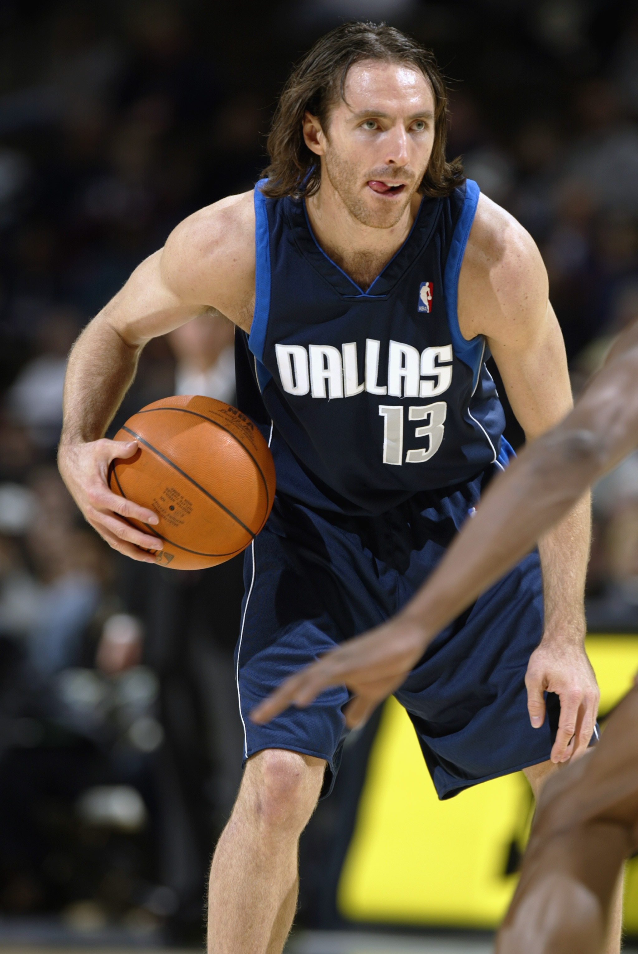DENVER - DECEMBER 18:  Steve Nash #13 of the Dallas Mavericks holds the ball during the game against the Denver Nuggets at Pepsi Center on December 18, 2002 in Denver, Colorado.  The Mavs won 80-75.   NOTE TO USER: User expressly acknowledges and agrees t