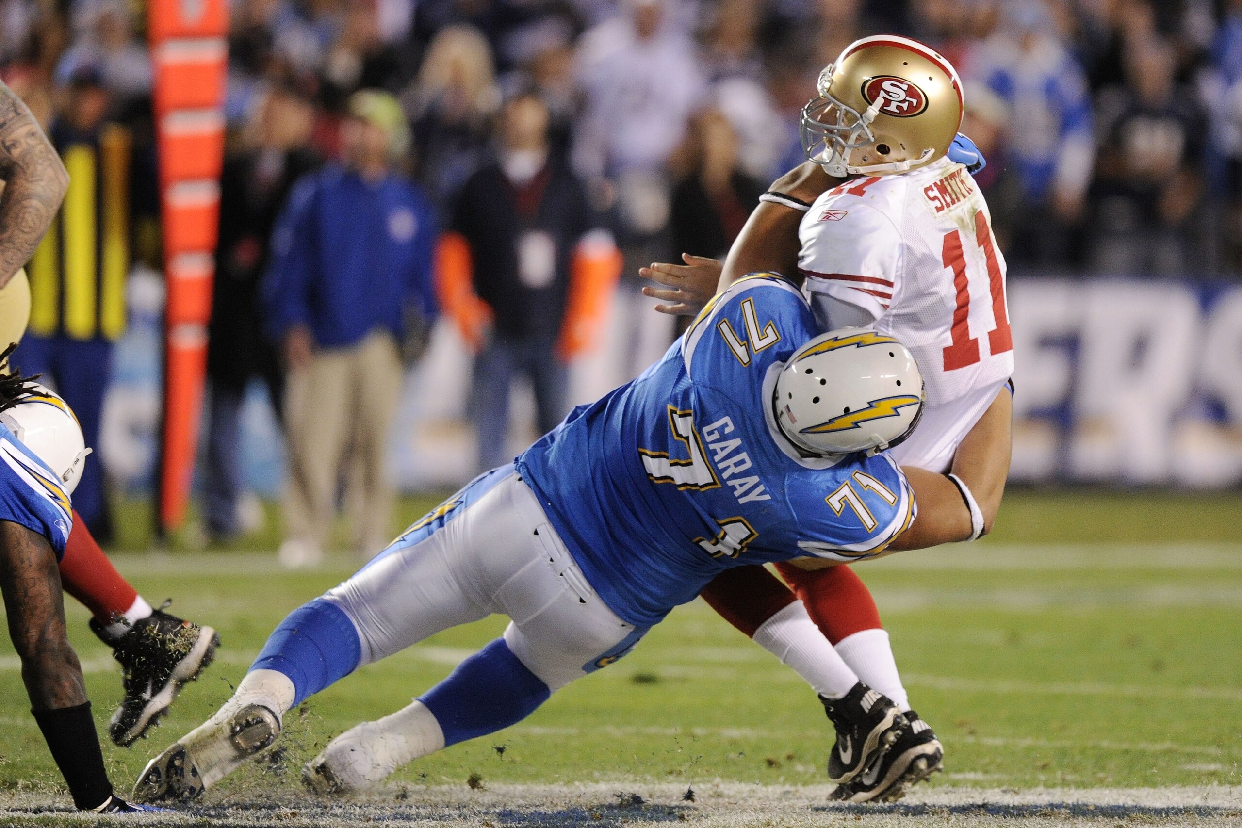 SAN DIEGO, CA - DECEMBER 16:  Quarterback Alex Smith #11 of the San Francisco 49ers is sacked by defensive tackle Antonio Garay #71 of the San Diego Chargers in the second quarter at Qualcomm Stadium on December 16, 2010 in San Diego, California.  (Photo