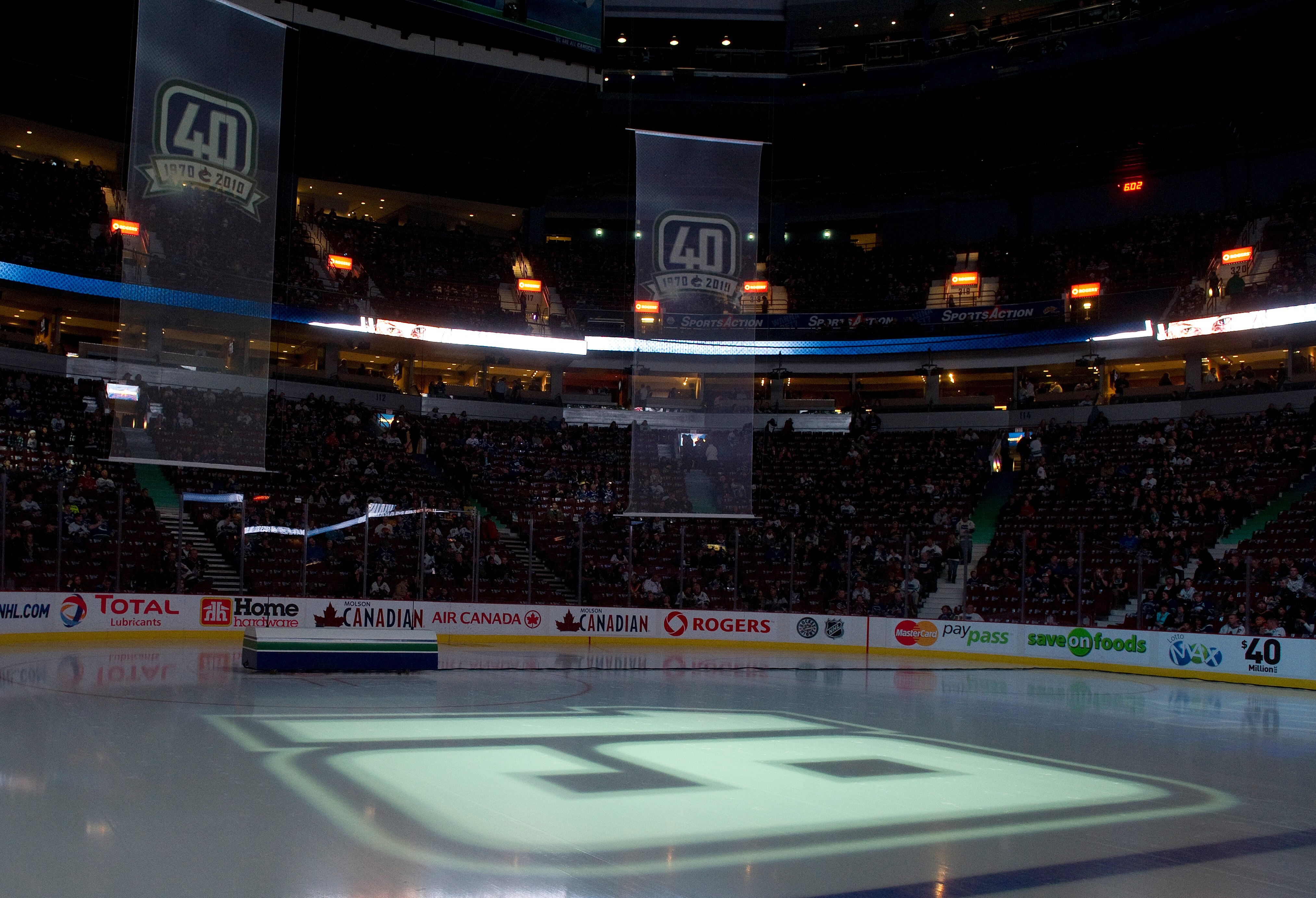VANCOUVER, CANADA - DECEMBER 11: The number 19 of Markus Naslund formerly of the of the Vancouver Canucks is projected on the ice during a ceremony to retire his jersey prior to NHL action against the Tampa Bay Lightning on December 11, 2010 at Rogers Are