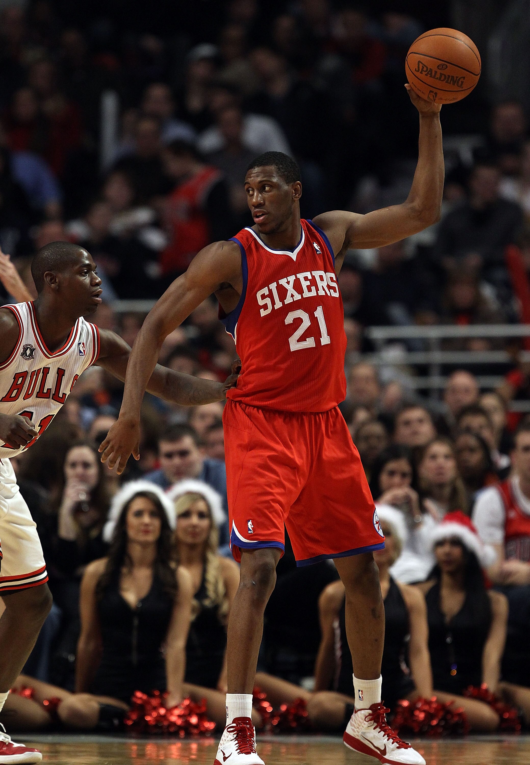CHICAGO, IL - DECEMBER 21: Thaddeus Young #21 of the Philadelphia 76ers looks to pass against the Chicago Bulls at the United Center on December 21, 2010 in Chicago, Illinois. The Bulls defeated the 76ers 121-76. NOTE TO USER: User expressly acknowledges 