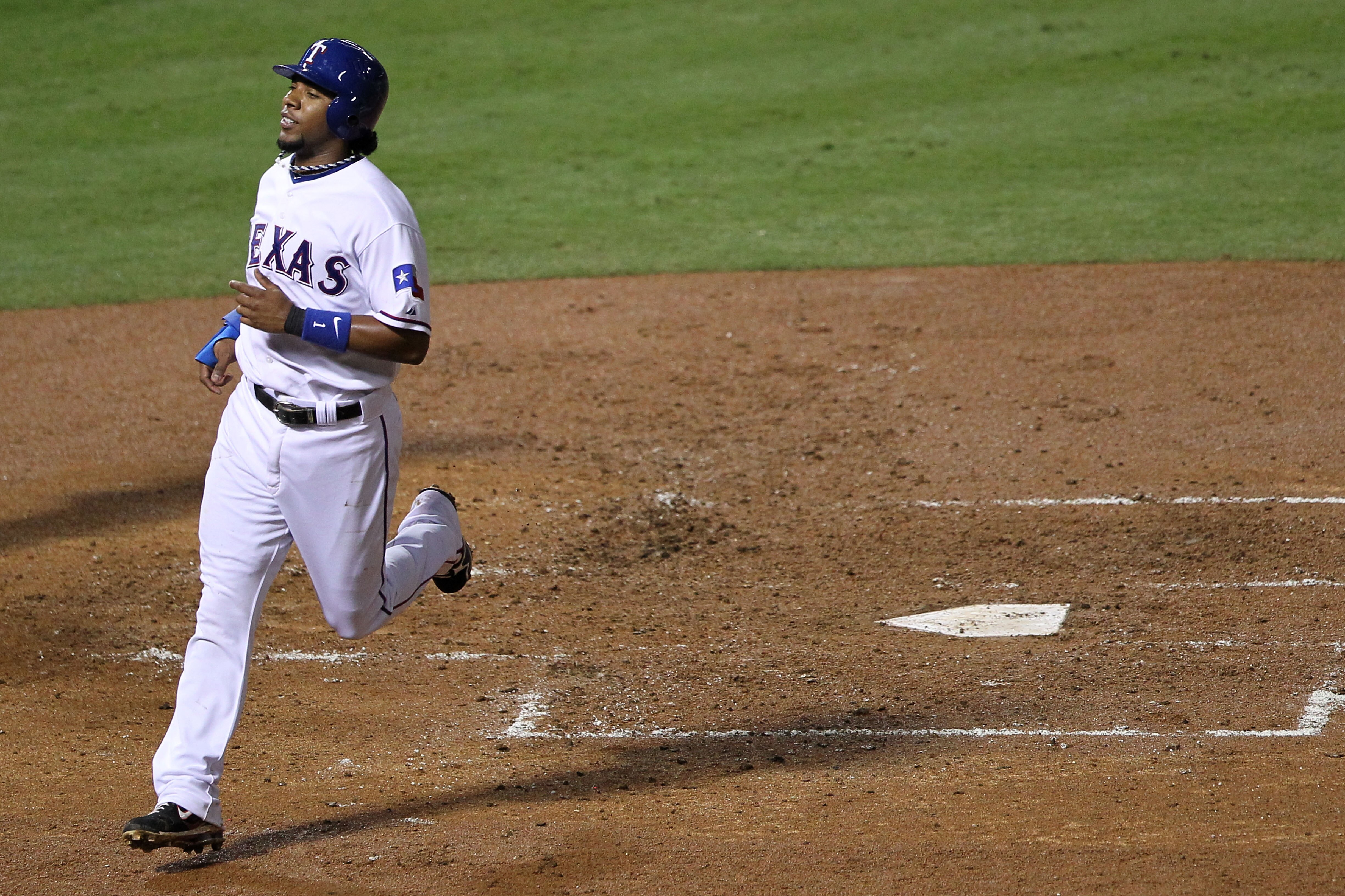 ARLINGTON, TX - OCTOBER 22:  Elvis Andrus #1 of the Texas Rangers crosses home plate to score against the New York Yankees in the first inning of Game Six of the ALCS during the 2010 MLB Playoffs at Rangers Ballpark in Arlington on October 22, 2010 in Arl
