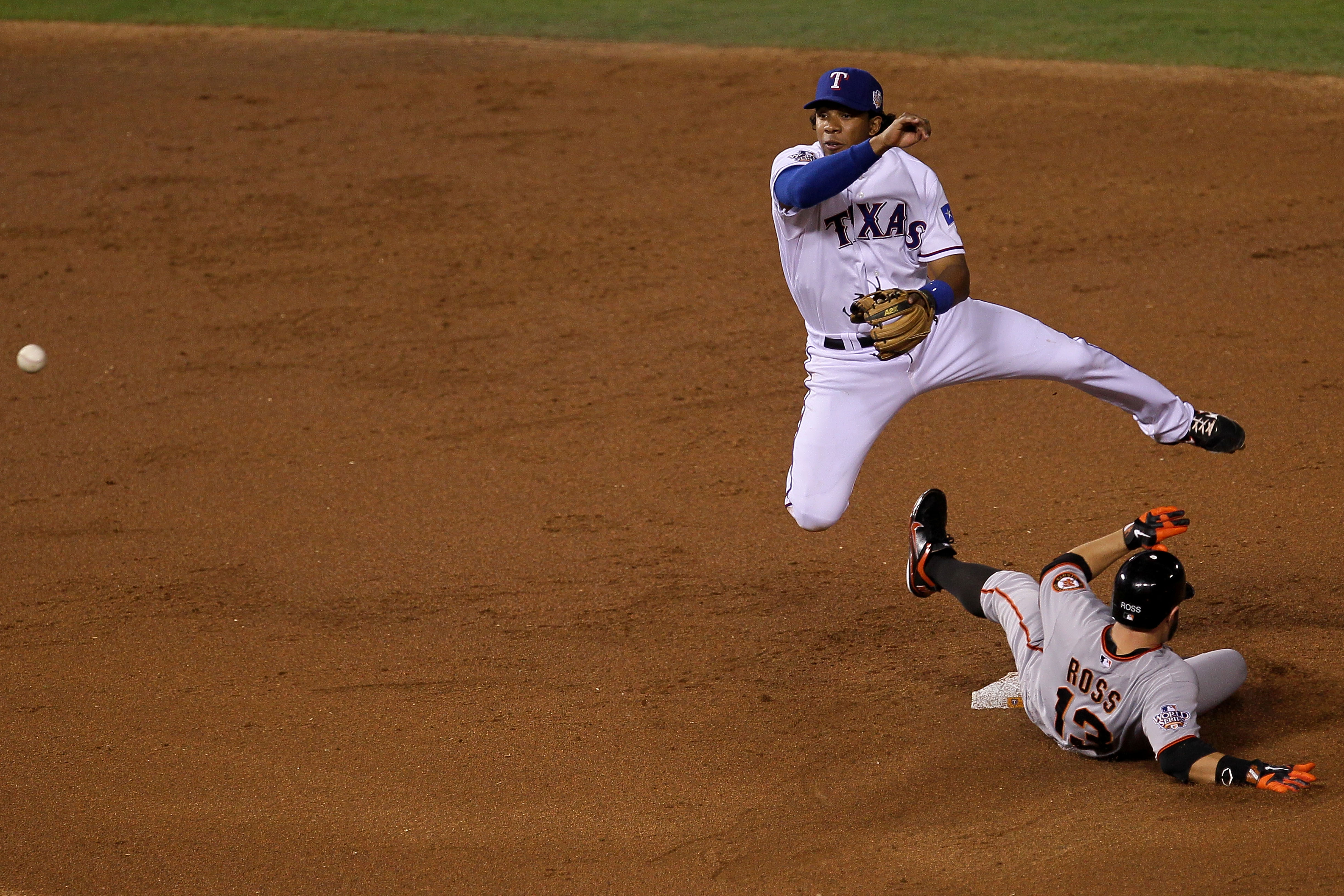 ARLINGTON, TX - OCTOBER 31:  Elvis Andrus #1 of the Texas Rangers forces out Cody Ross #13 of the San Francisco Giants on a fielder's choice hit by Travis Ishikawa #10 in the second ining of Game Four of the 2010 MLB World Series at Rangers Ballpark in Ar