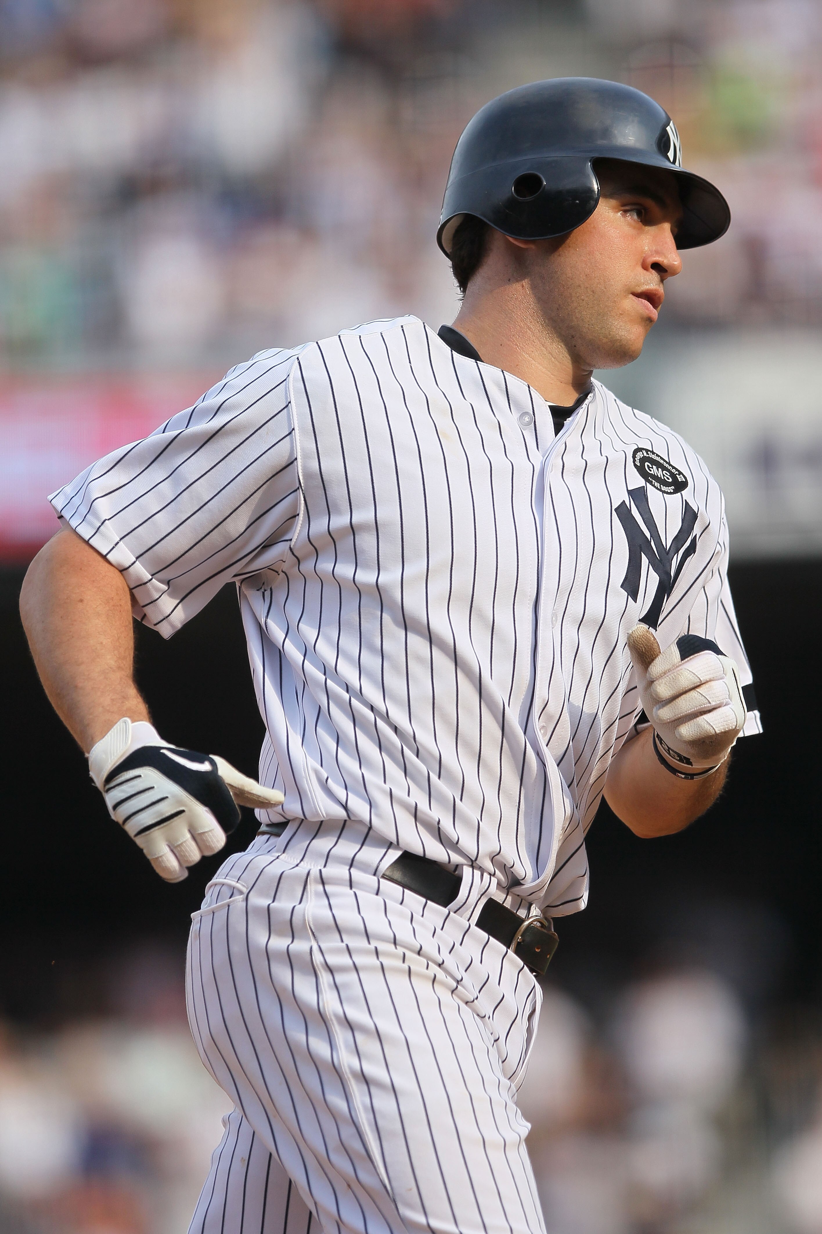 NEW YORK - AUGUST 09:  Mark Teixeira #25 of the New York Yankees rounds the bases after hitting a home run in the 8th inning against the Boston Red Sox during their game on August 9, 2010 at Yankee Stadium in the Bronx borough of New York City.  (Photo by