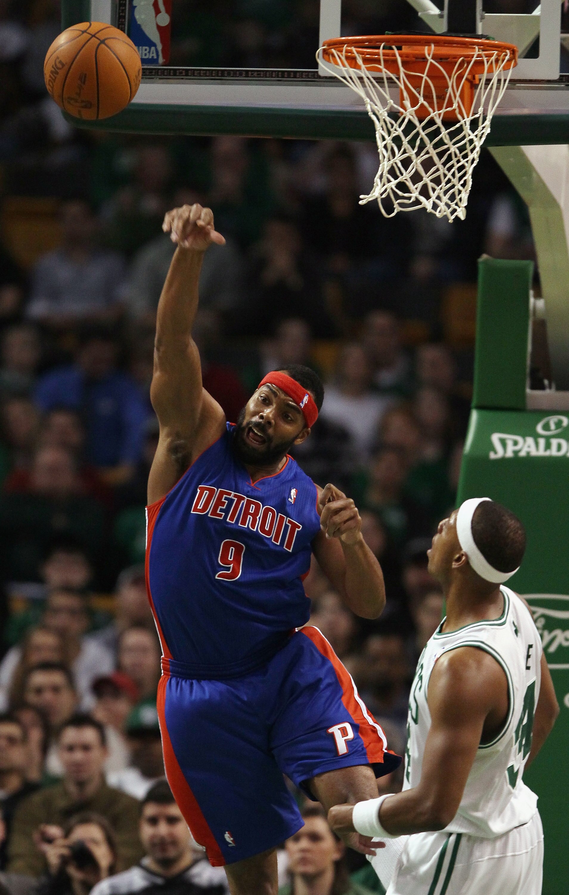 BOSTON, MA - JANUARY 19:  Chris Wilcox #9 of the Detroit Pistons passes the ball as Paul Pierce #34 of the Boston Celtics defends on January 19, 2011 at the TD Garden in Boston, Massachusetts.  NOTE TO USER: User expressly acknowledges and agrees that, by
