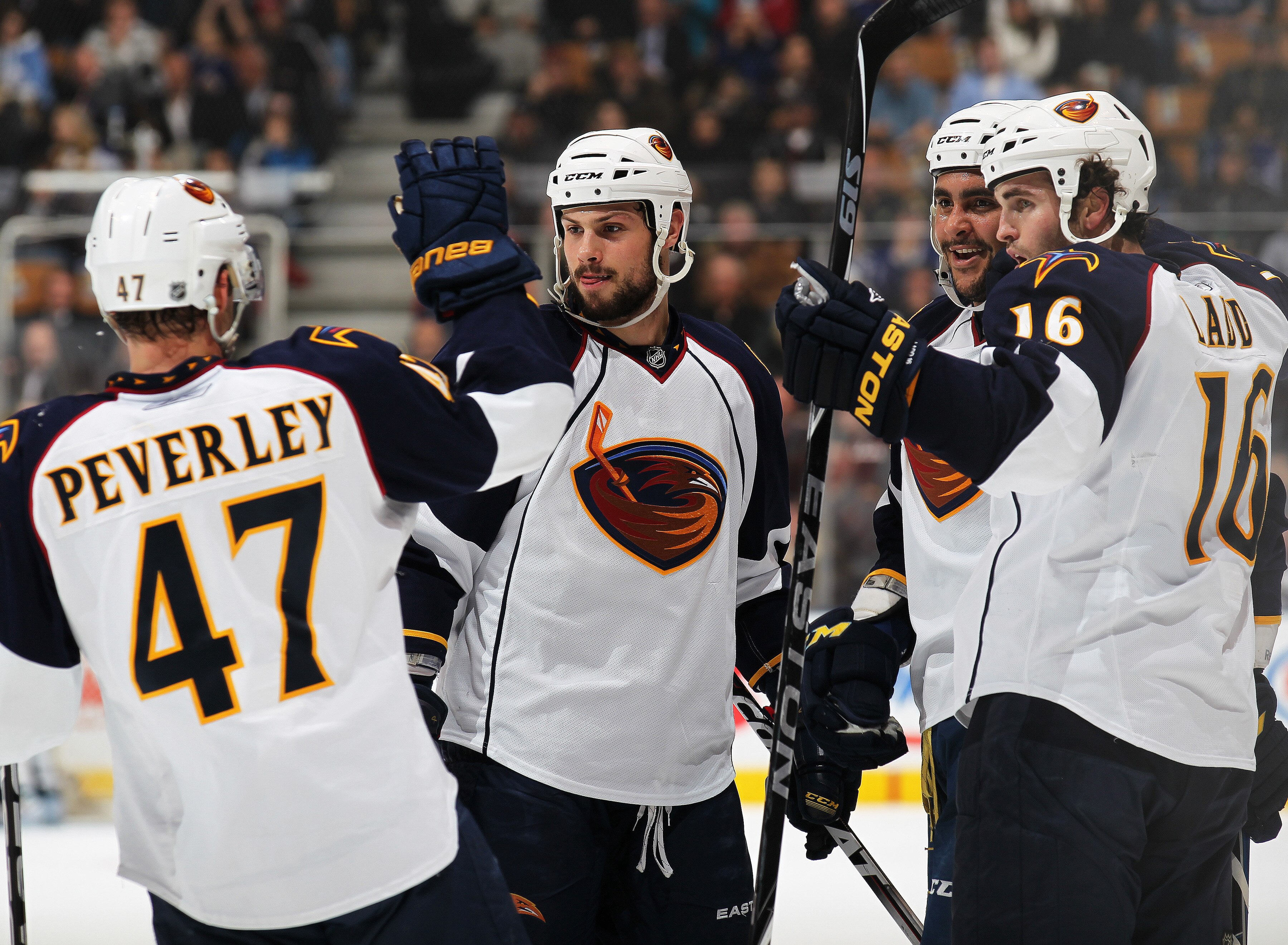 TORONTO, CAN - FEBRUARY 7:  Dustin Byfuglien #33 of the Atlanta Thrashers celebrates his goal with teammates Rich Peverley #47, Zach Bogosian #4, and Andrew Ladd #16 in a game against the Toronto Maple Leafs on February 7, 2011 at the Air Canada Centre in