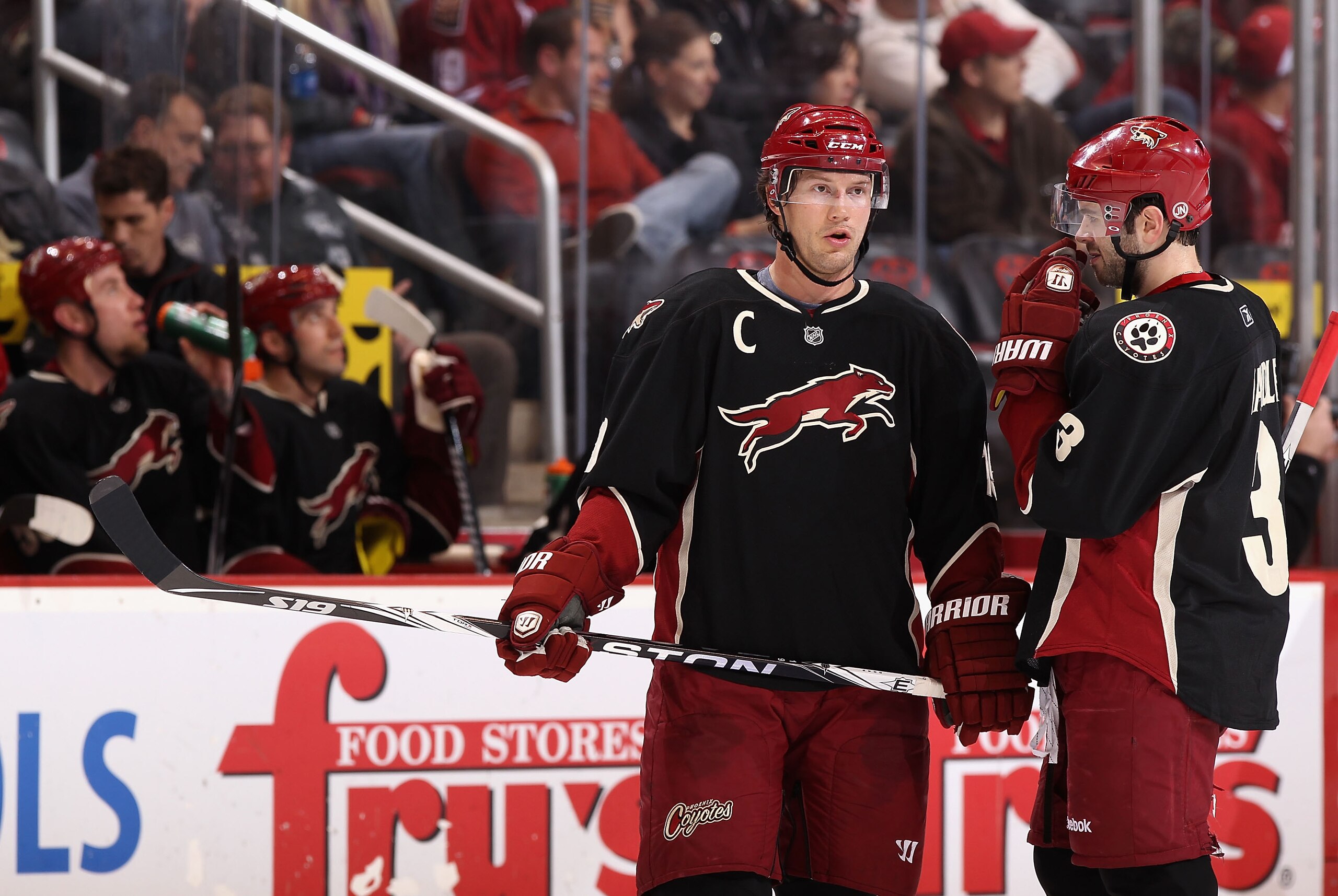 GLENDALE, AZ - JANUARY 18:  Shane Doan #19 and Keith Yandle #3 of the Phoenix Coyotes talk during the NHL game against  the Nashville Predators at Jobing.com Arena on January 18, 2011 in Glendale, Arizona.  The Predators defeated the Coyotes 5-2.  (Photo