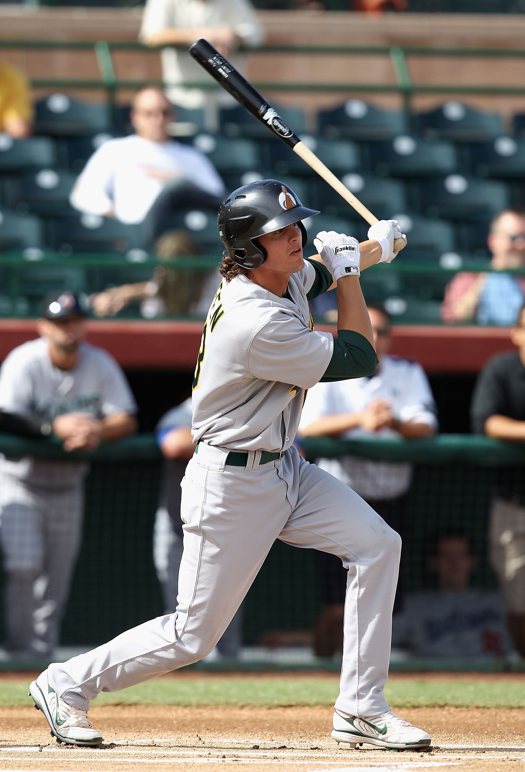 SCOTTSDALE, AZ - OCTOBER 23:  Oakland Athletics prospect Grant Green playing for the Phoenix Desert Dogs hits a single against the Scottsdale Scorpions during the AZ Fall League game at Scottsdale Stadium on October 23, 2010 in Scottsdale, Arizona.  (Phot