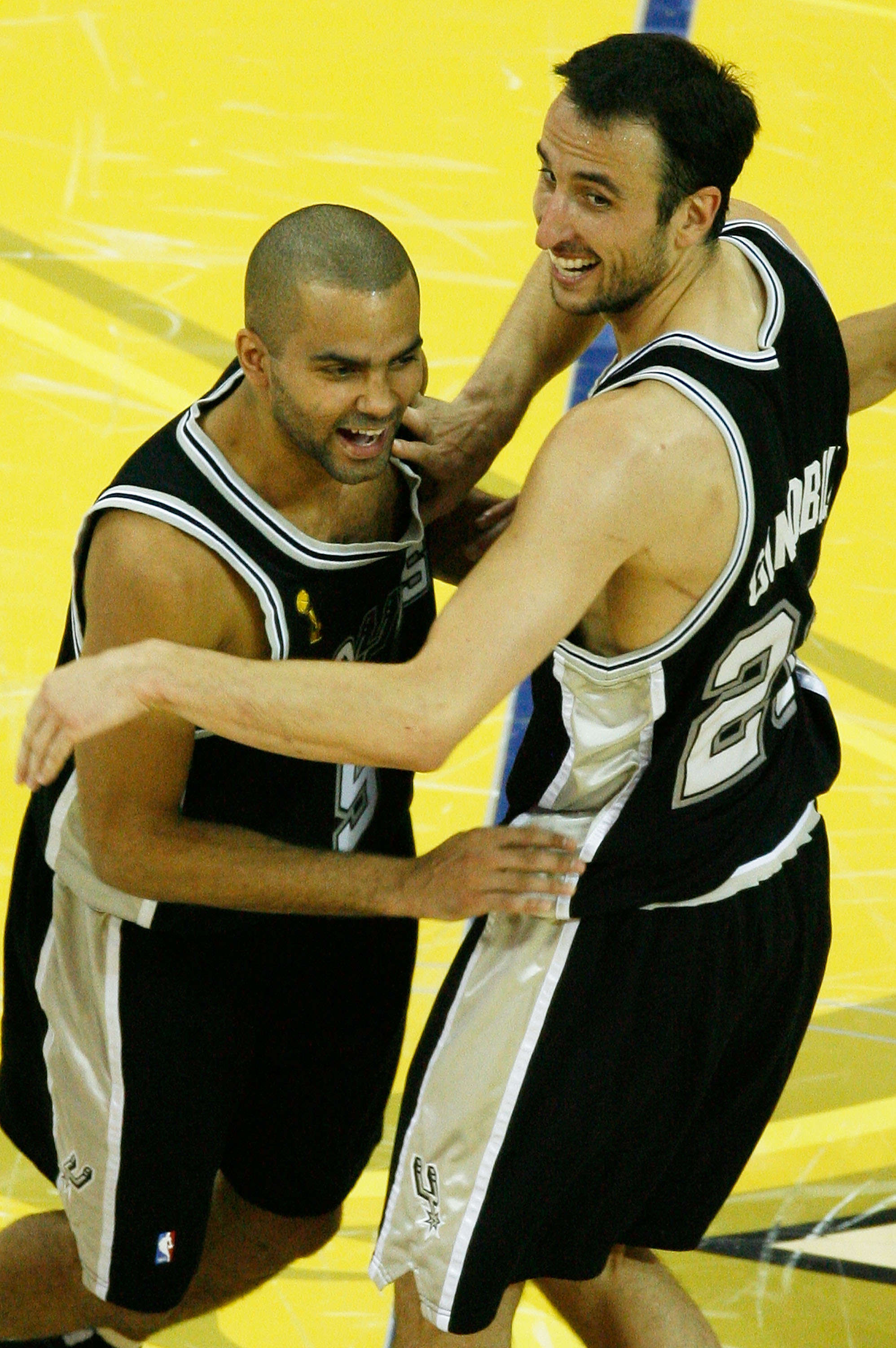 CLEVELAND - JUNE 14: Manu Ginobili #20 and Tony Parker #9 of the San Antonio Spurs celebrate their 83-82 victory over the Cleveland Cavaliers to win Game Four of the NBA Finals on June 14, 2007 at the Quicken Loans Arena in Cleveland, Ohio. NOTE TO USER:
