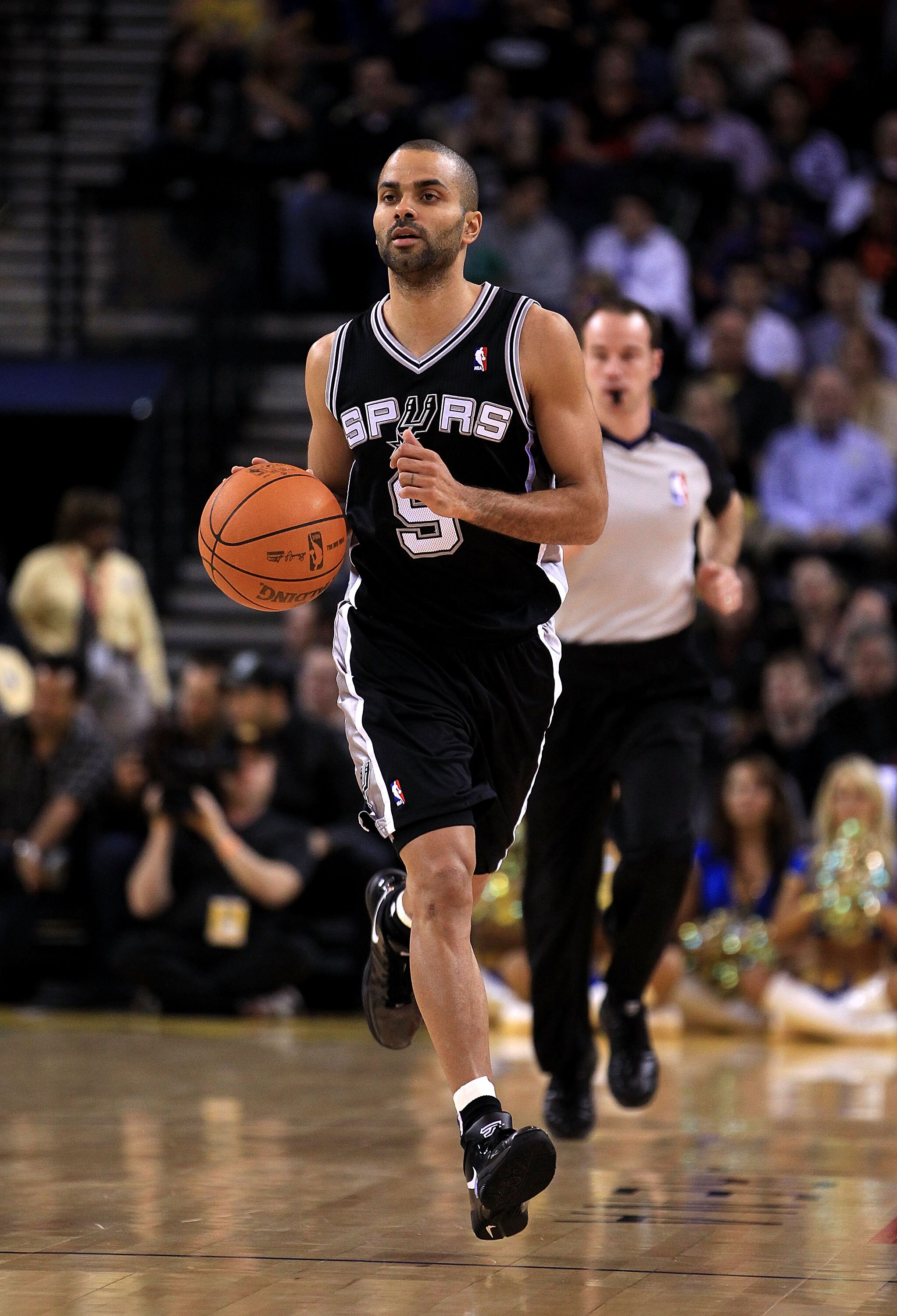 OAKLAND, CA - JANUARY 24:  Tony Parker #9 of the San Antonio Spurs in action against the Golden State Warriors at Oracle Arena on January 24, 2011 in Oakland, California.  NOTE TO USER: User expressly acknowledges and agrees that, by downloading and or us