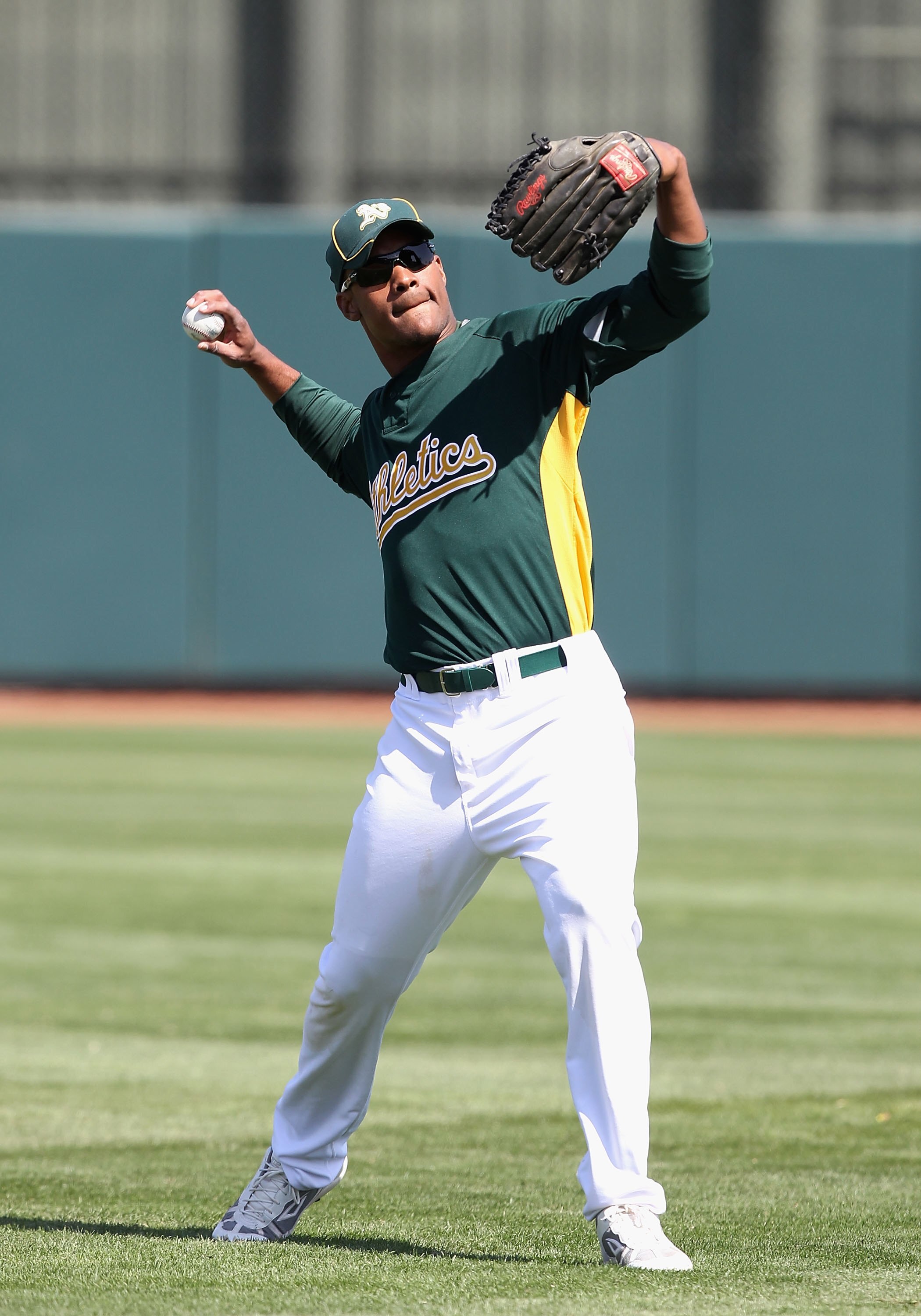 PHOENIX - MARCH 10:  Michael Taylor #23 of the Oakland Athletics warms up before the MLB spring training game against the Chicago White Sox at Phoenix Municipal Stadium on March 10, 2010 in Phoenix, Arizona. The White Sox defeated the A's 9-5  (Photo by C
