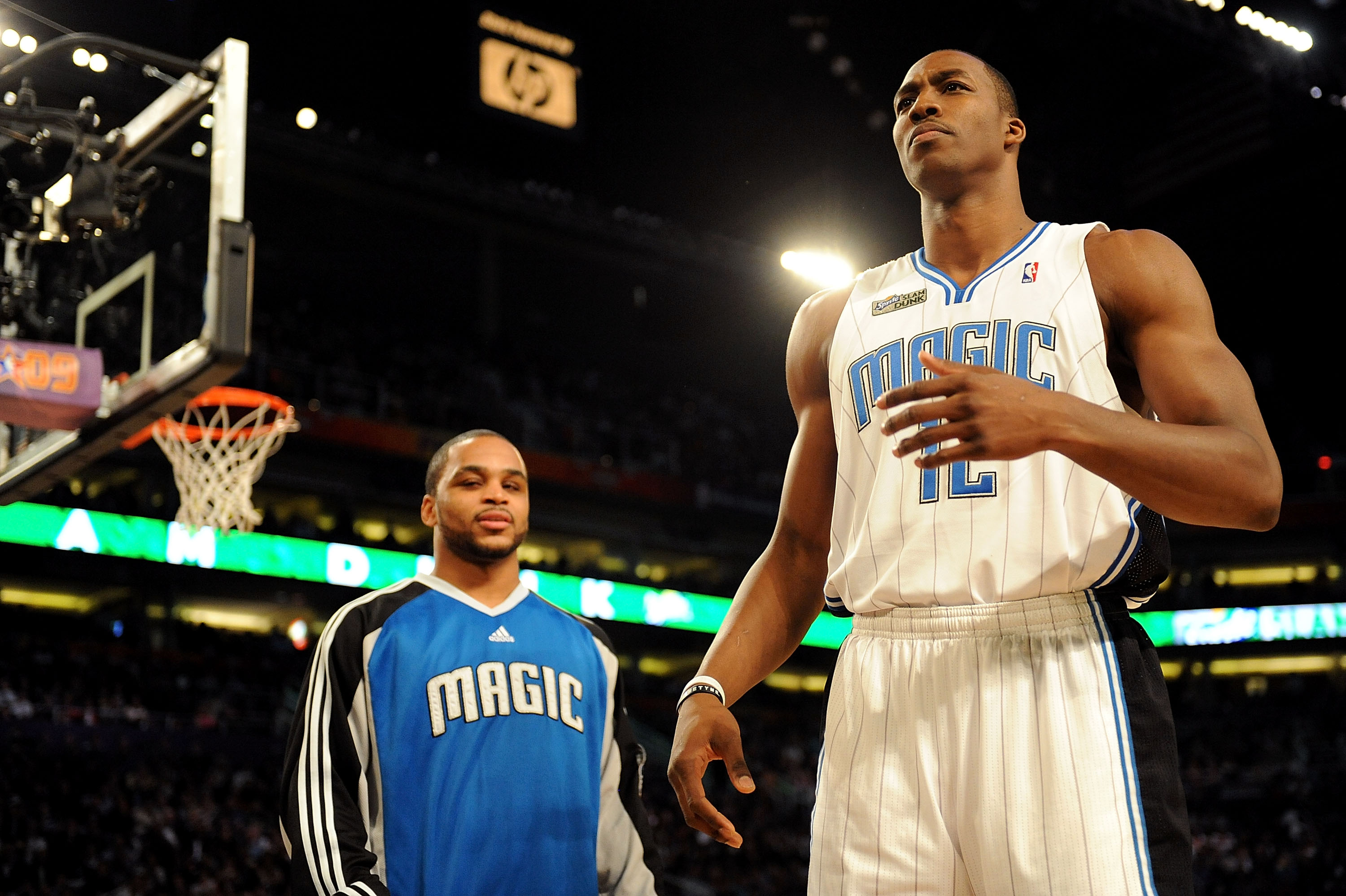 PHOENIX - FEBRUARY 14:  Jameer Nelson helps out teammate Dwight Howard of the Orlando Magic in the Sprite Slam Dunk Contest on All-Star Saturday Night, part of 2009 NBA All-Star Weekend at US Airways Center on February 14, 2009 in Phoenix, Arizona.  NOTE