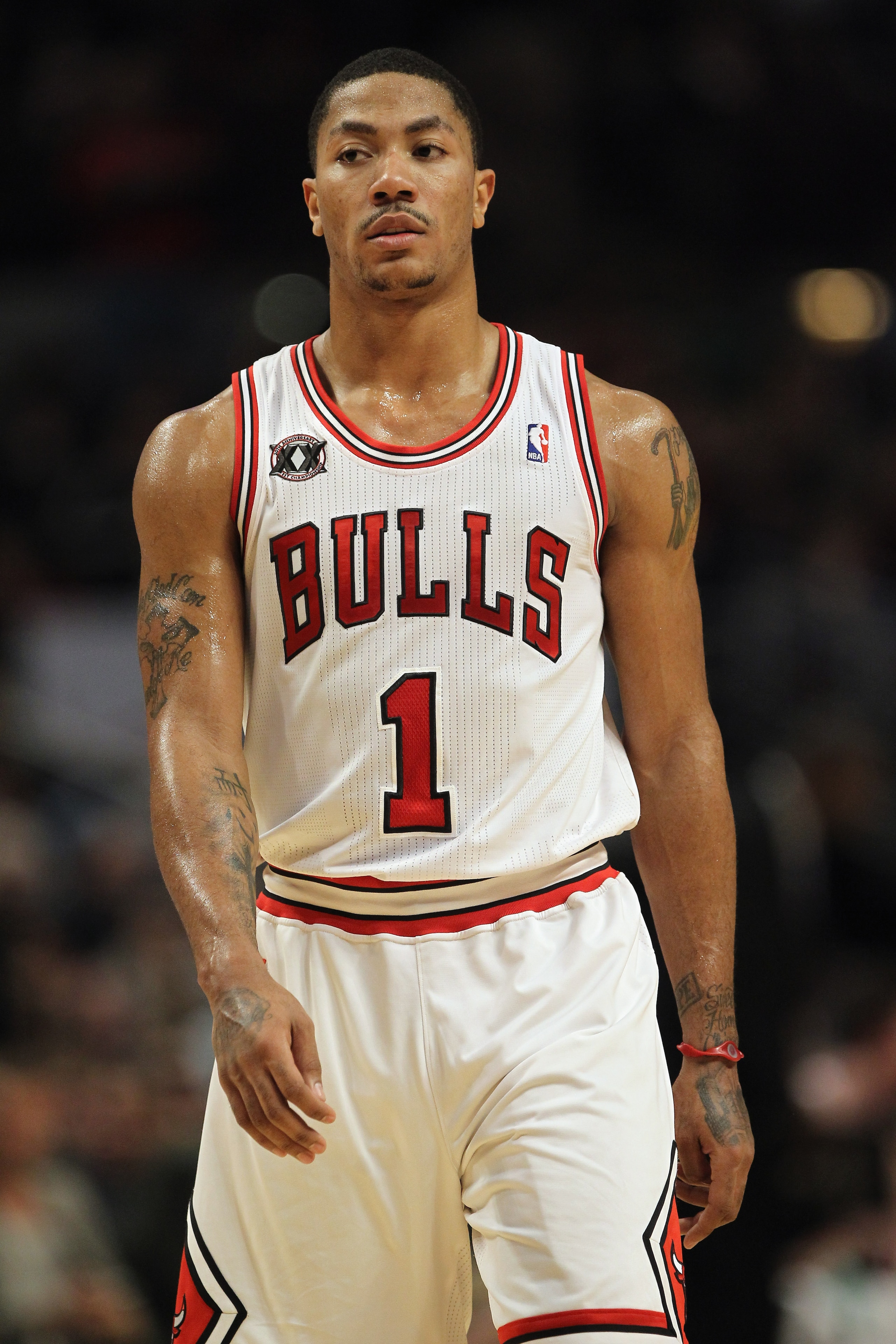 CHICAGO, IL - JANUARY 15:  Derrick Rose #1 of the Chicago Bulls looks on during a break in the action against the Miami Heat at the United Center on January 15, 2011 in Chicago, Illinois. NOTE TO USER: User expressly acknowledges and agrees that, by downl