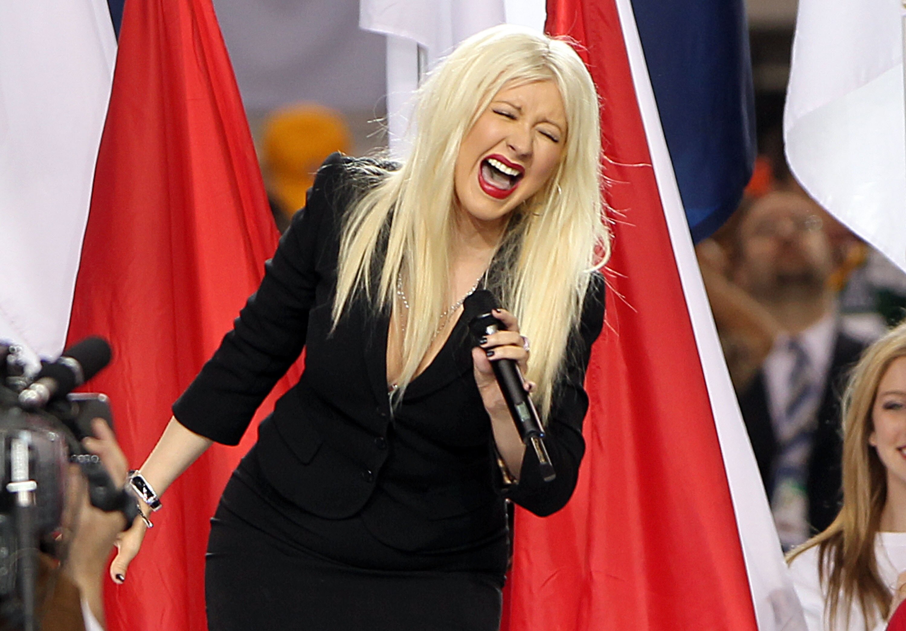 ARLINGTON, TX - FEBRUARY 06:  Singer Christina Aguilera performs during the Bridgestone Super Bowl XLV Pregame Show at Dallas Cowboys Stadium on February 6, 2011 in Arlington, Texas.  (Photo by Christopher Polk/Getty Images)