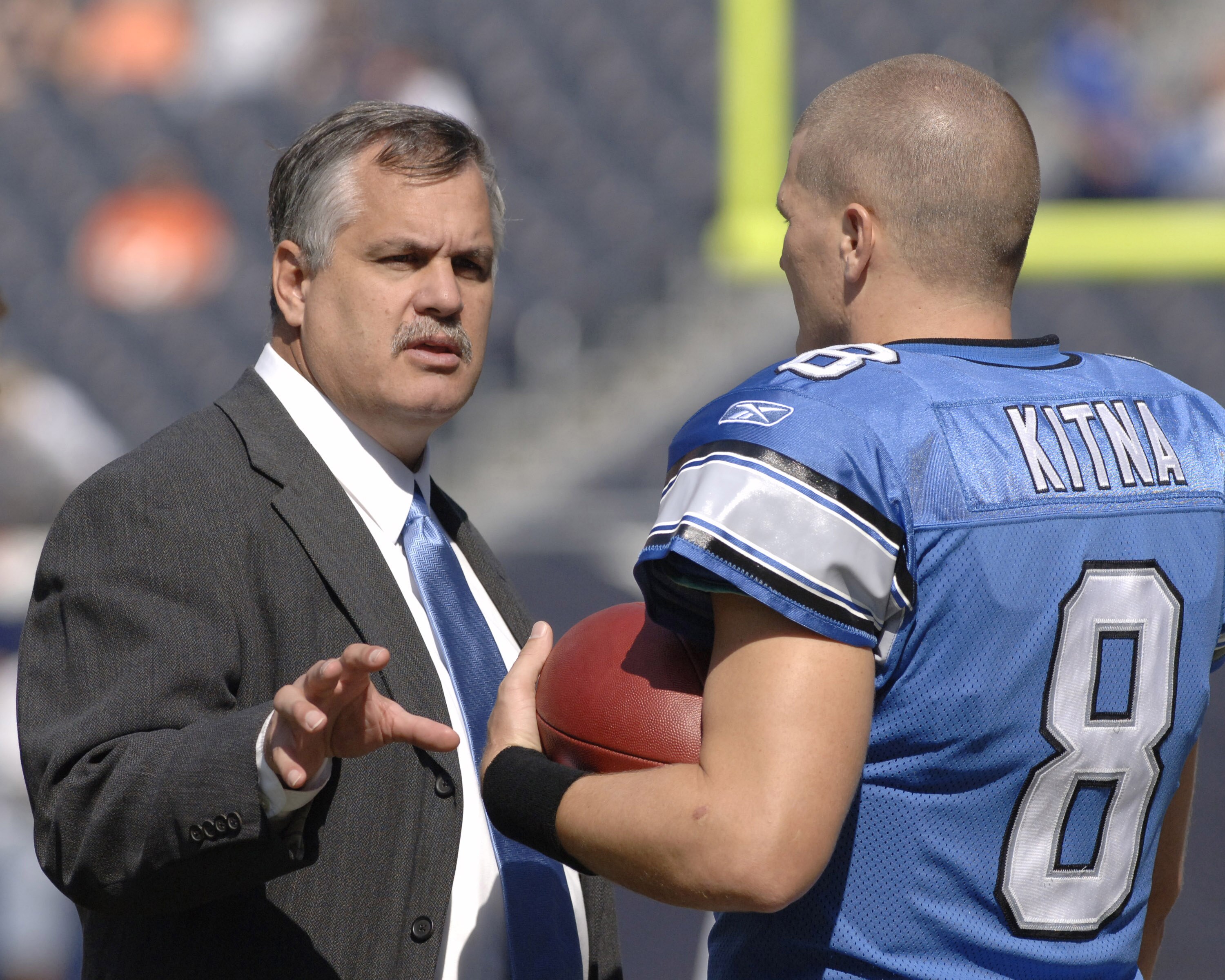 Detroit Lions president Matt Millen with quarterback Jon Kitna before a game between the Chicago Bears and Detroit Lions at Soldier Field in Chicago, Illinois on September 17, 2006.  (Photo by Al Messerschmidt/Getty Images)