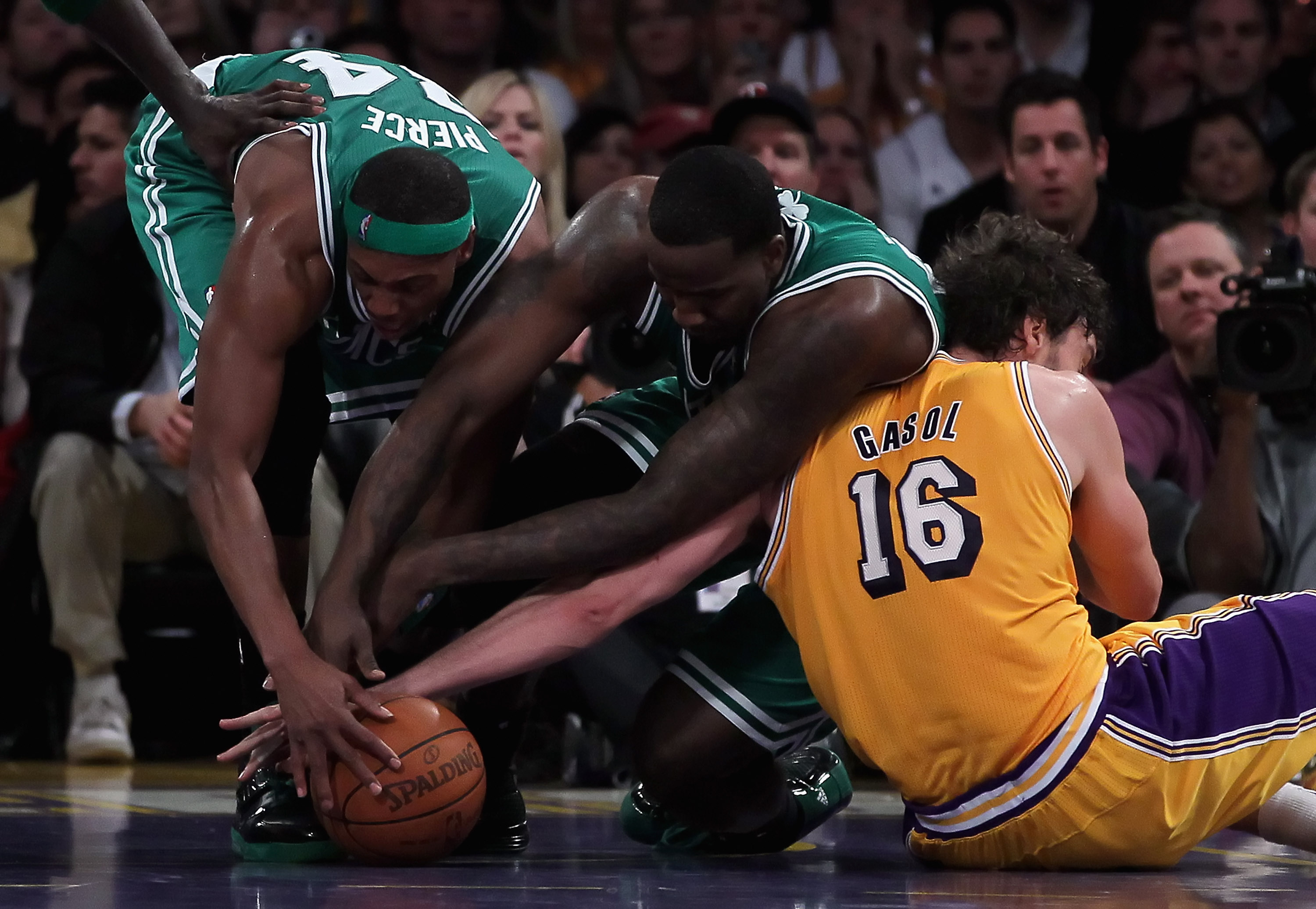 LOS ANGELES, CA - JANUARY 30:  (L-R) Paul Pierce #34 and Kendrick Perkins #43 of the Boston Celtics fight for a loose ball with Pau Gasol #16 of the Los Angeles Lakers in the second half at Staples Center on January 30, 2011 in Los Angeles, California. Th