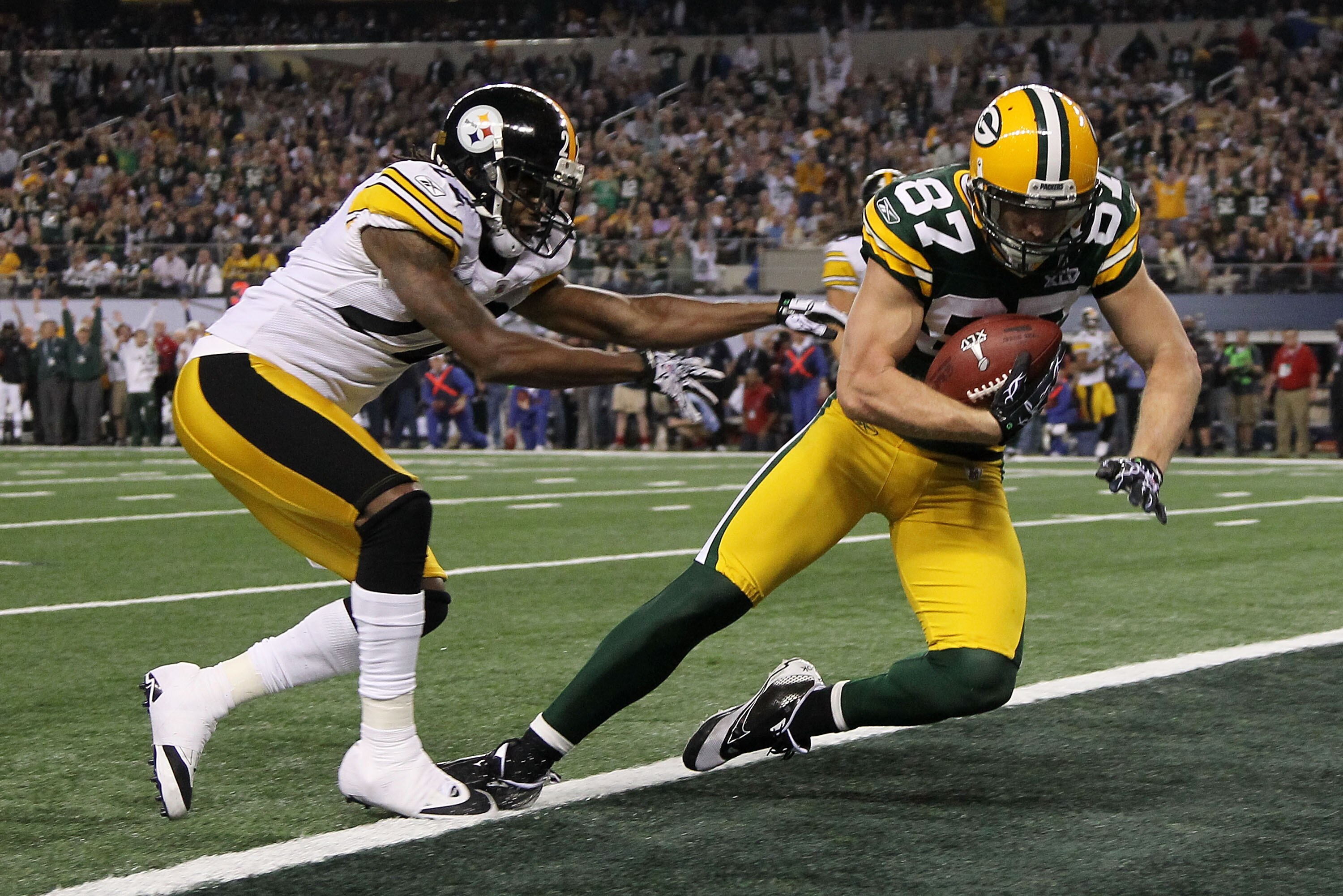 ARLINGTON, TX - FEBRUARY 06:  Jordy Nelson #87 of the Green Bay Packers catches a 29 yard touchdown pass over William Gay #22 of the Pittsburgh Steelers during the first quarter of Super Bowl XLV at Cowboys Stadium on February 6, 2011 in Arlington, Texas.
