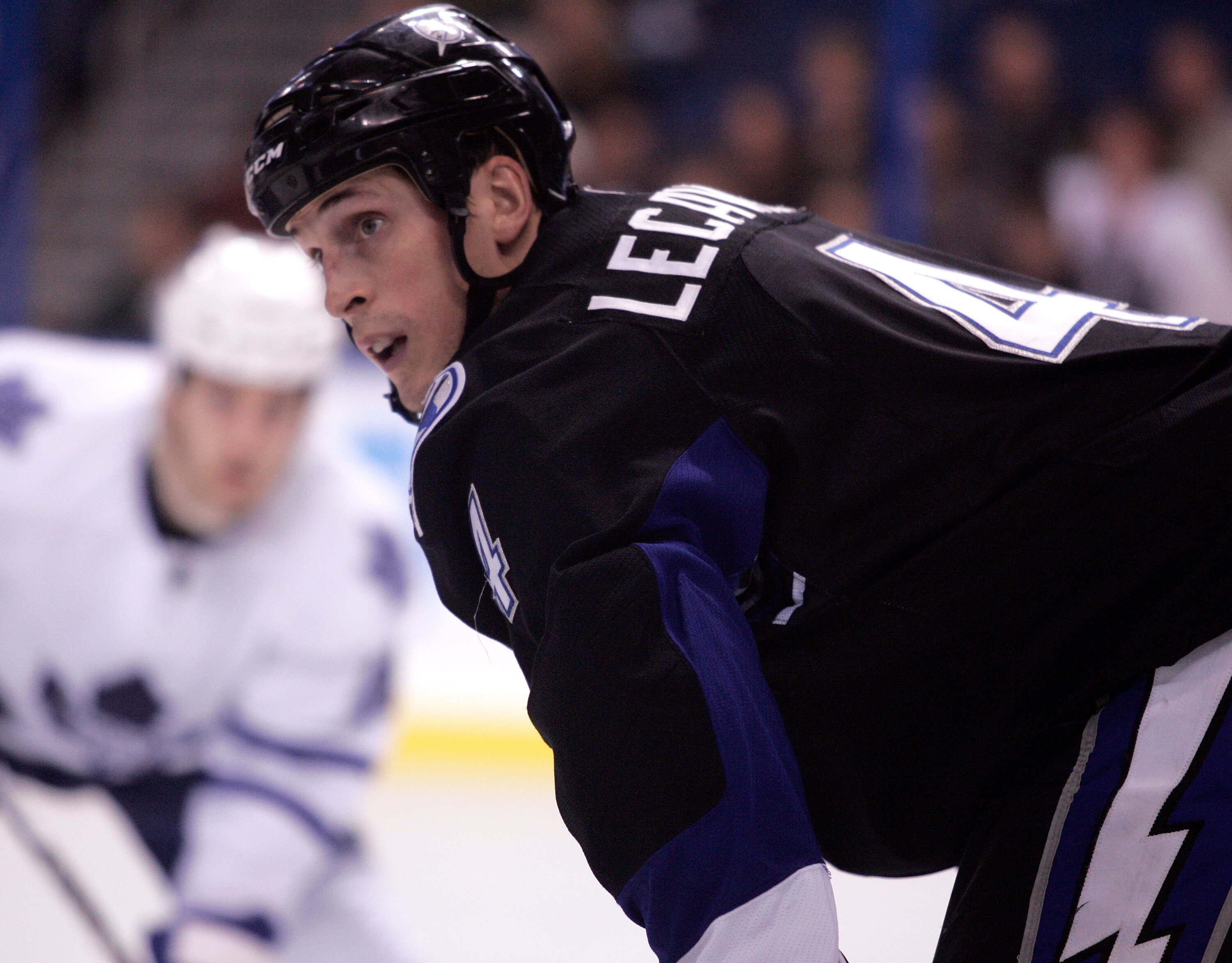 TAMPA, FL - JANUARY 25:  Vincent Lecavalier #4 of the Tampa Bay Lightning gets ready for a face-off against the Toronto Maple Leafs at St. Pete Times Forum on January 25, 2011 in Tampa, Florida.  The Lightning defeated the Leafs 2-0.  (Photo by Justin K.