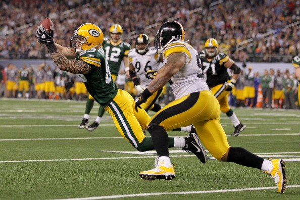 ARLINGTON, TX - FEBRUARY 06:  Tom Crabtree #83 of the Green Bay Packers attempts to catch a ball infront of LaMarr Woodley #56 of the Pittsburgh Steelers during Super Bowl XLV at Cowboys Stadium on February 6, 2011 in Arlington, Texas.  (Photo by Doug Pen
