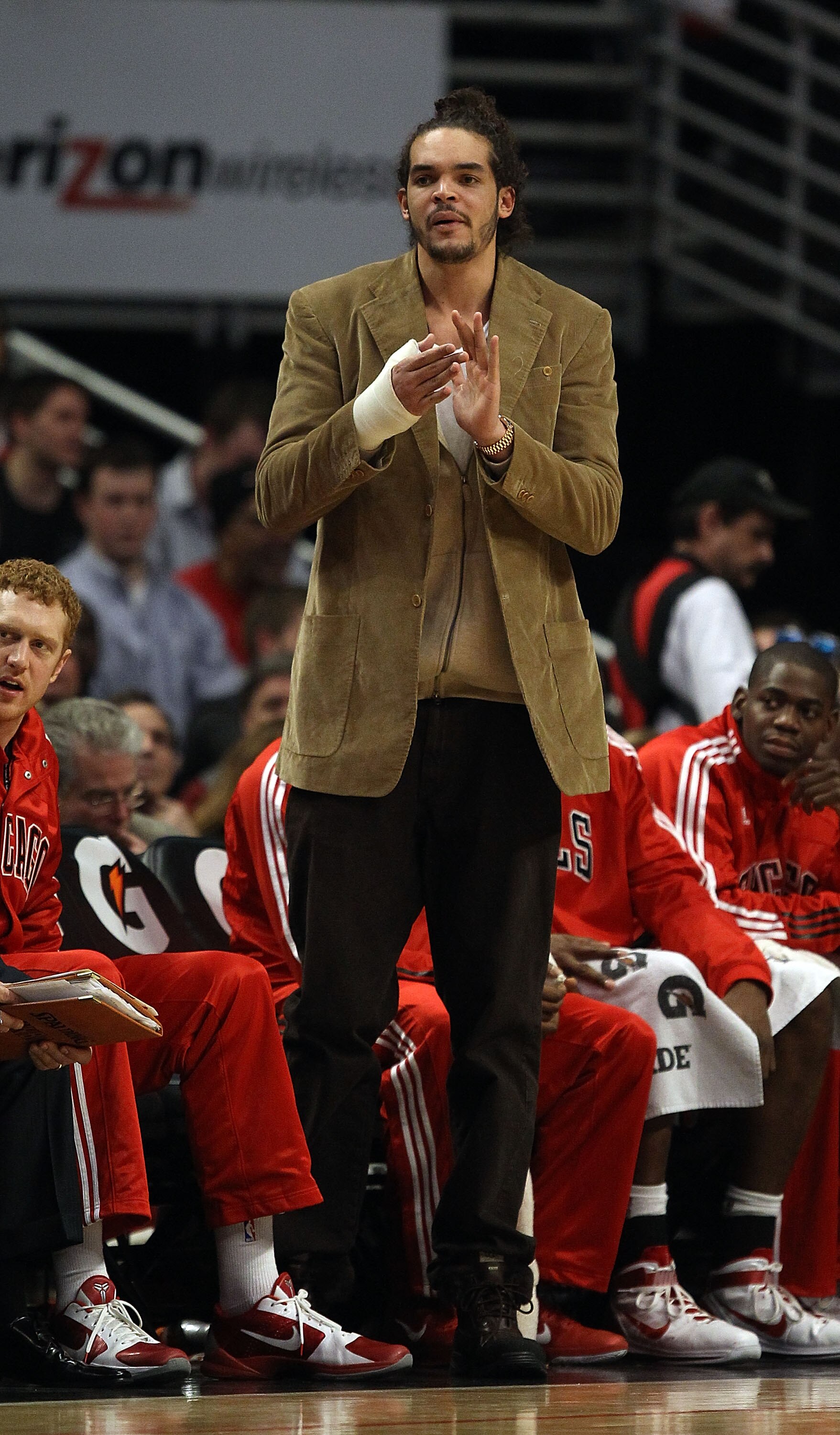 CHICAGO, IL - JANUARY 28: Injured player Joakim Noah of the Chicago Bulls encourages teammates from the bench during a game against the Orlando Magic at the United Center on January 28, 2011 in Chicago, Illinois. The Bulls defeated the Magic 99-90. NOTE T