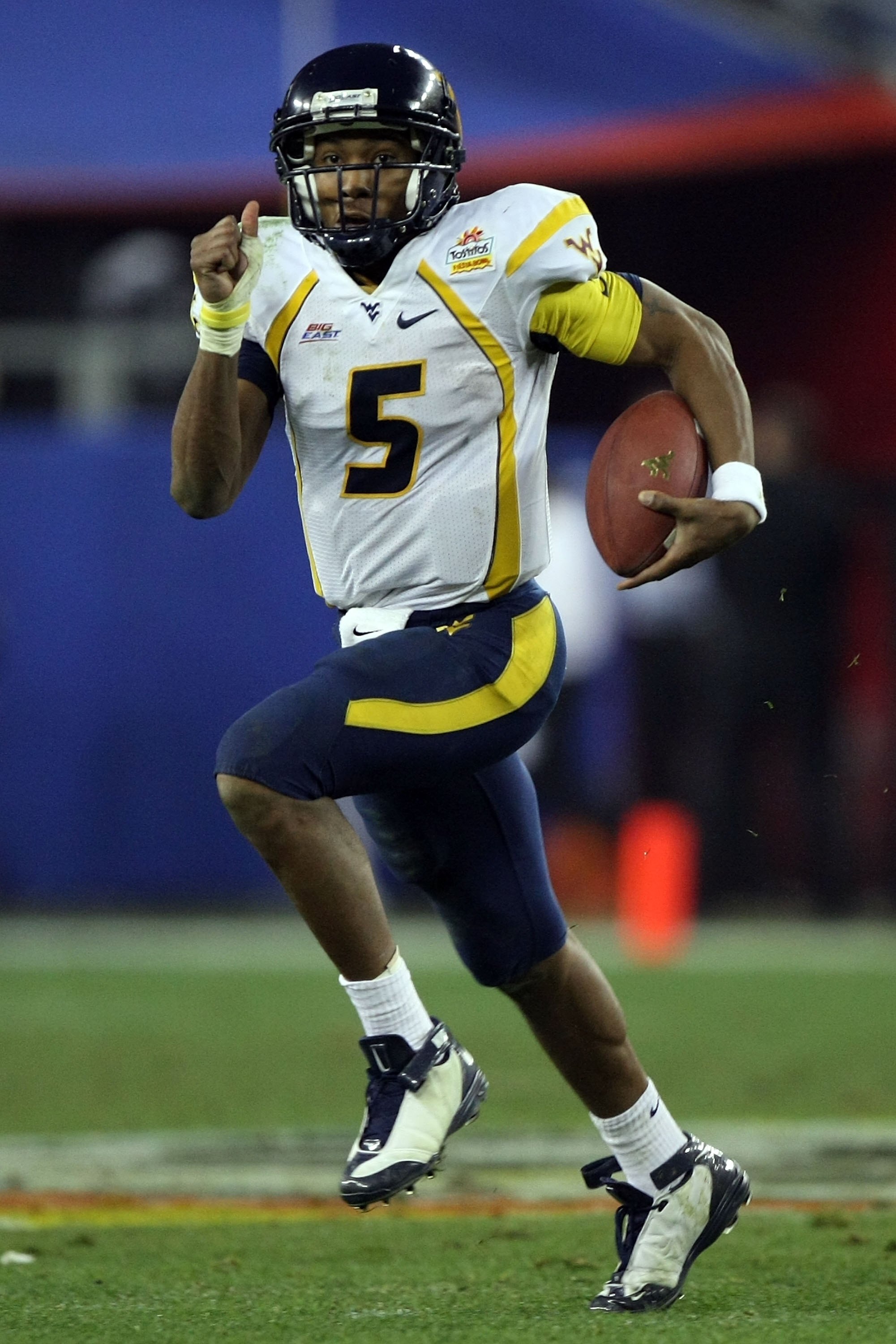 GLENDALE, AZ - JANUARY 02:  Quarterback Patrick White #5 of the West Virginia Mountaineers runs the ball against the Oklahoma Sooners at the Tostito's Fiesta Bowl at University of Phoenix Stadium January 2, 2008 in Glendale, Arizona.  (Photo by Jed Jacobs