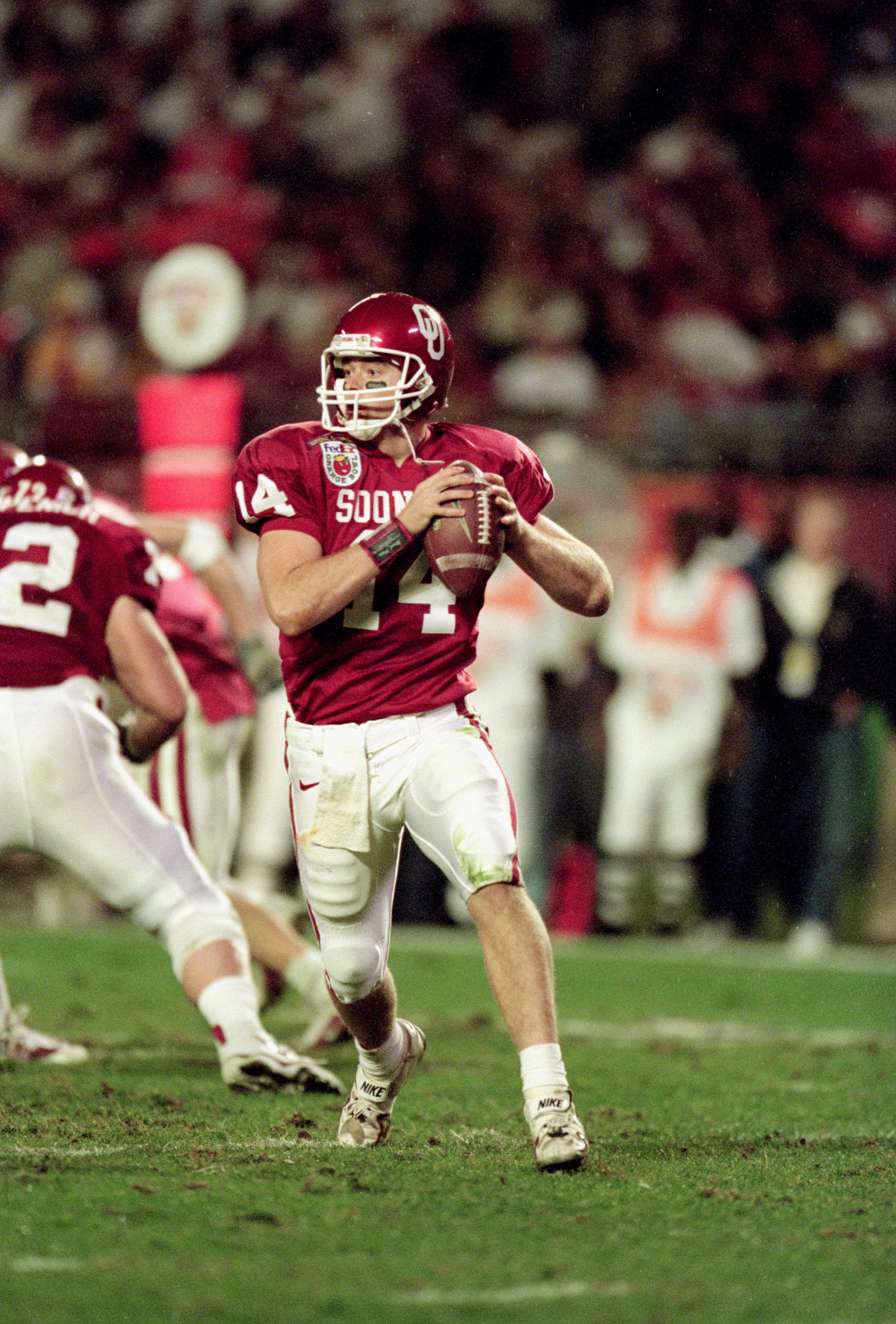 3 Jan 2001: Quarterback Josh Heupel #14 of the Oklahoma Sooners scrambles to pass the ball during the Orange Bowl Game against the Florida State Seminoles at the Pro Players Stadium in Miami, Florida.  The Sooners defeated the Seminoles 13-2.Mandatory Cre