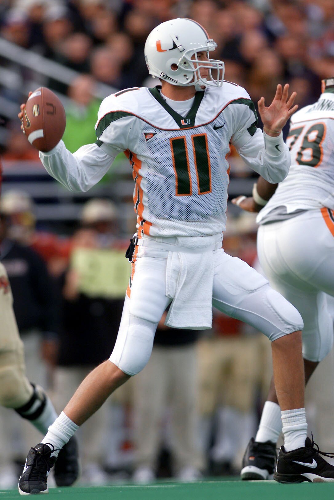 10 Nov 2001:  Quarterback Ken Dorsey #11 of the Miami Hurricanes throws his fourth interception of the day during the second half of Saturday's game between the Miami Hurricanes and the Boston College Eagles at Alumni Field in Boston, Massachussetts.  Dig