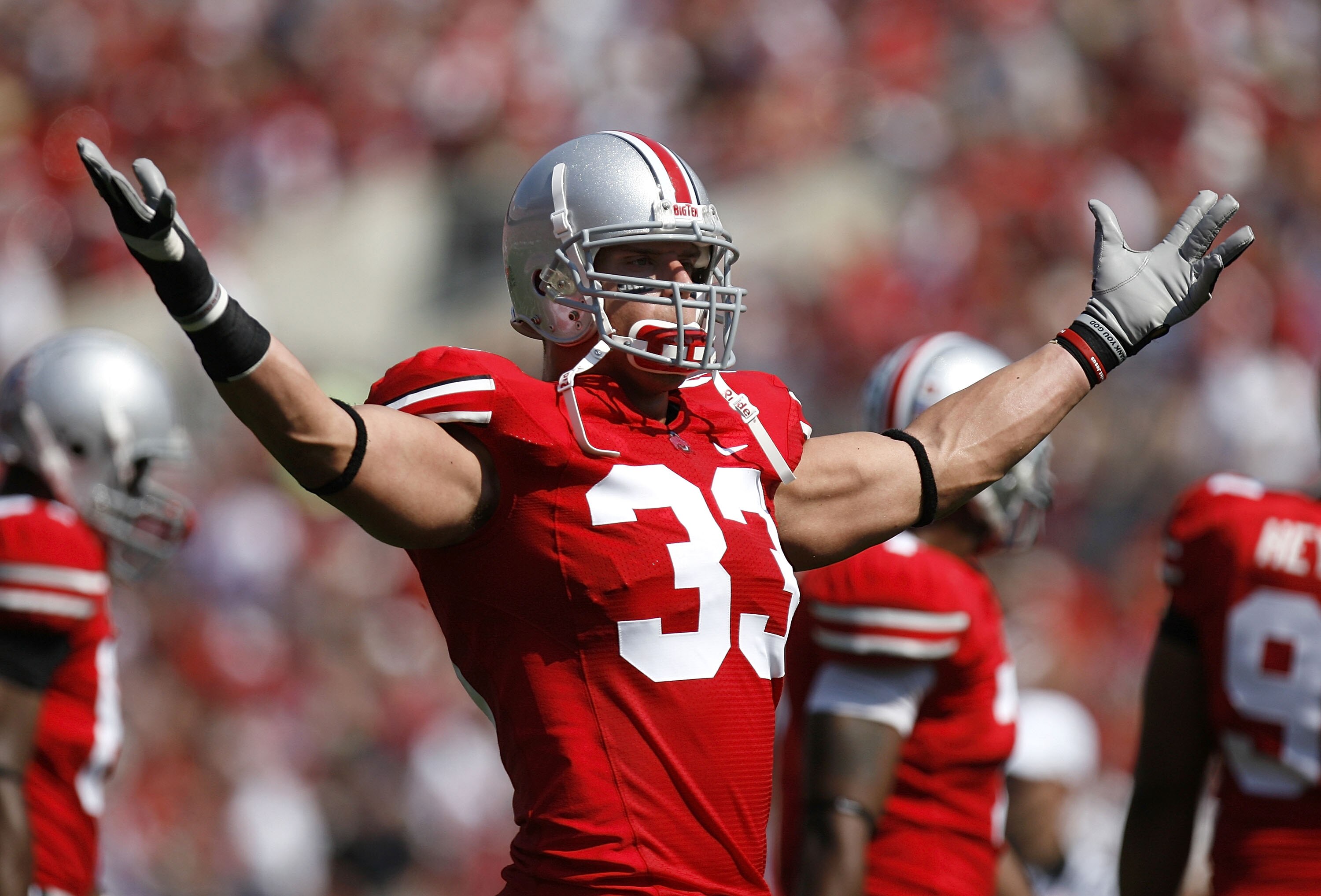 COLUMBUS, OH - SEPTEMBER 20: James Laurinaitis #33 of the Ohio State Buckeyes tries to get the fans loud in the second quarter while playing the Troy Trojans on September 20, 2008 at Ohio Stadium in Columbus, Ohio. Ohio State won the game 28-10.  (Photo b