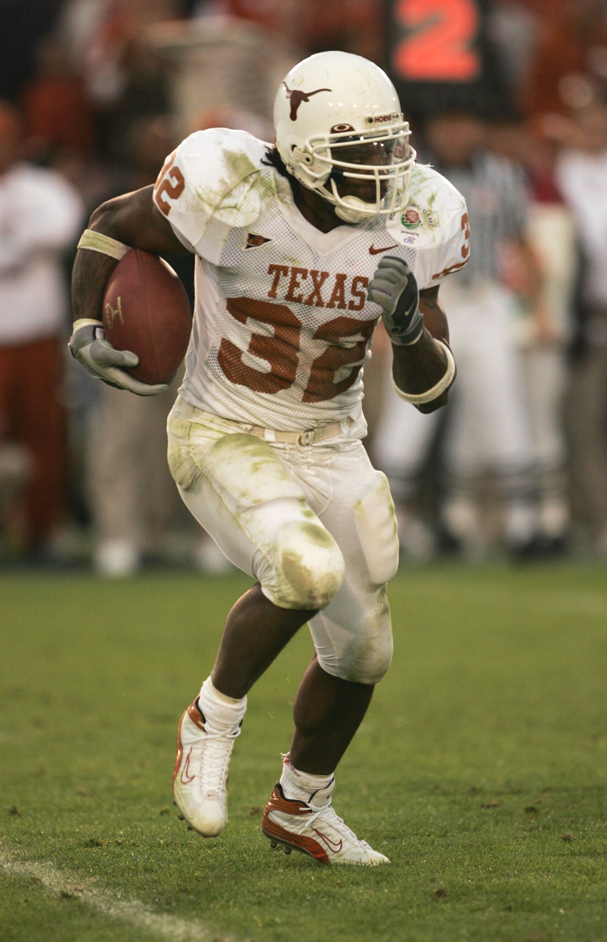 PASADENA, CA - JANUARY 1: Running back Cedric Benson #32 of the Texas Longhorns looks for room to run against the Michigan Wolverines in the 91st Rose Bowl Game at the Rose Bowl on January 1, 2005 in Pasadena, California. Texas defeated Michigan 38-37. (P