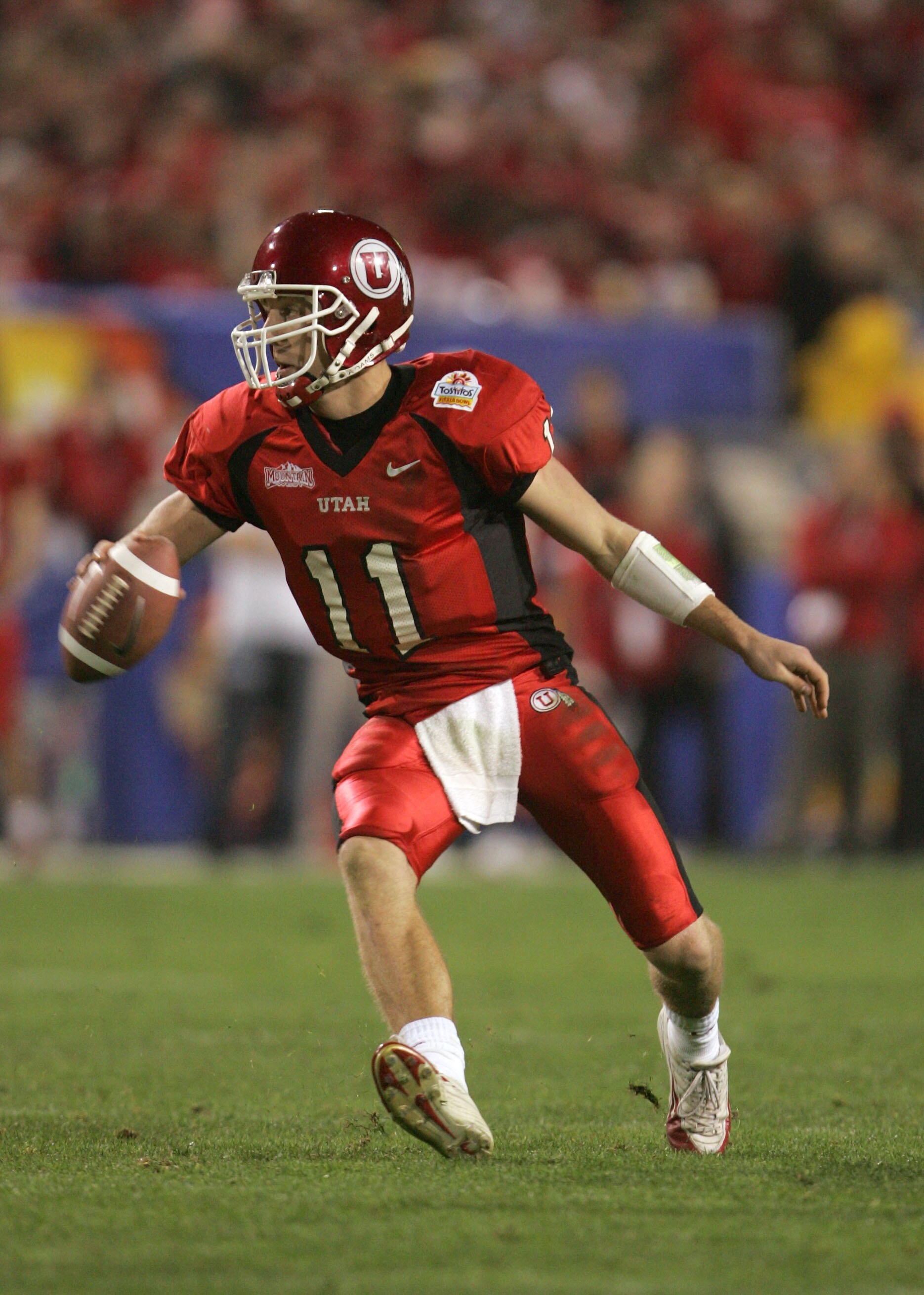TEMPE, AZ - JANUARY 1:  Quarterback Alex Smith #11 of Utah looks to pass against Pittsburgh in the second quarter of the Tostito's Fiesta Bowl at the Sun Devil Stadium on January 1, 2005 in Tempe, Arizona. (Photo by Jeff Gross/Getty Images).