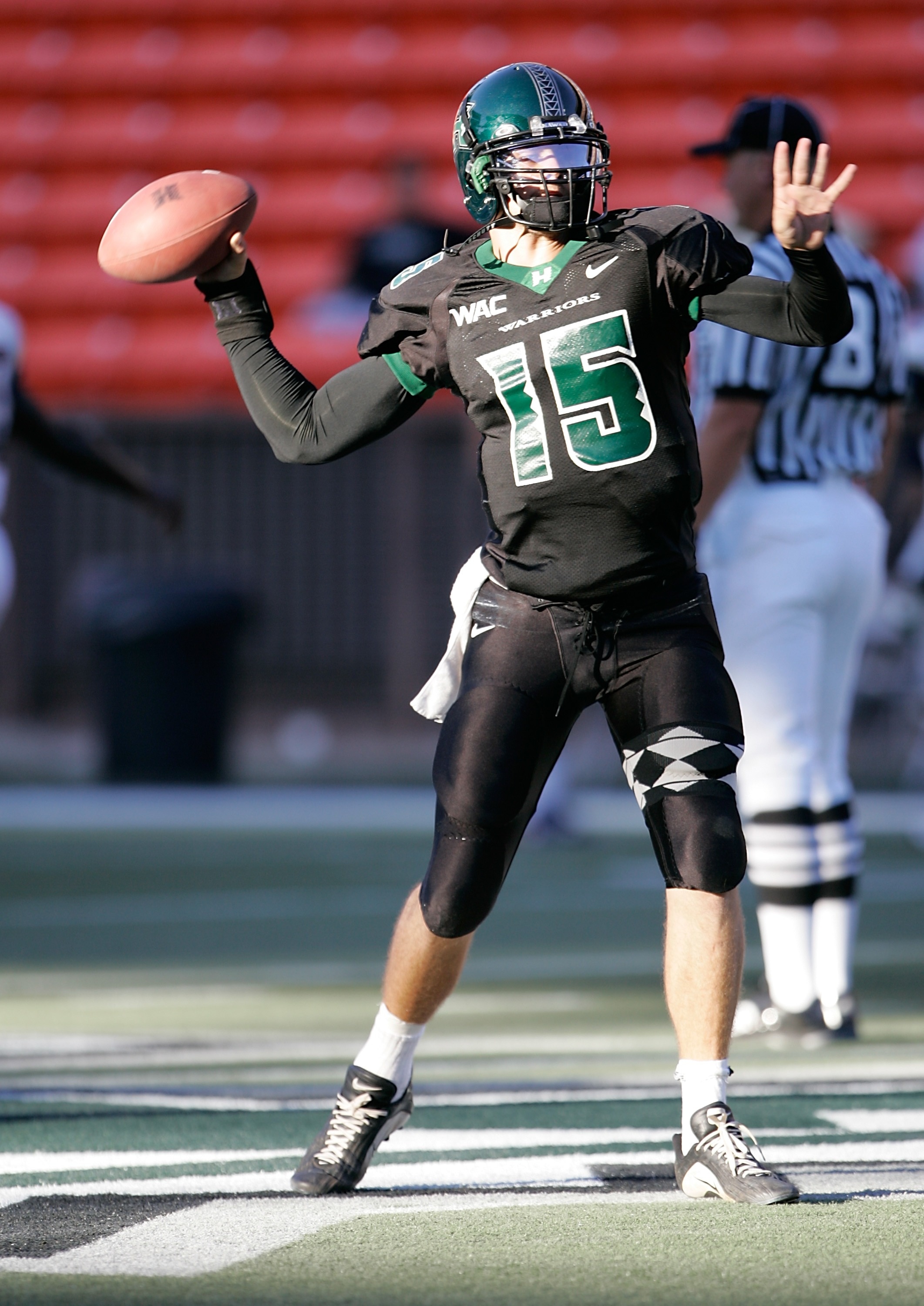 HONOLULU - SEPTEMBER 22:   Quarterback Colt Brennan #15 of the University of Hawaii Warriors practices on the field before the start of their game against the Charleston Southern Bucs at Aloha Stadium, September 22, 2007 in Honolulu, Hawaii.  (Photo by Ma