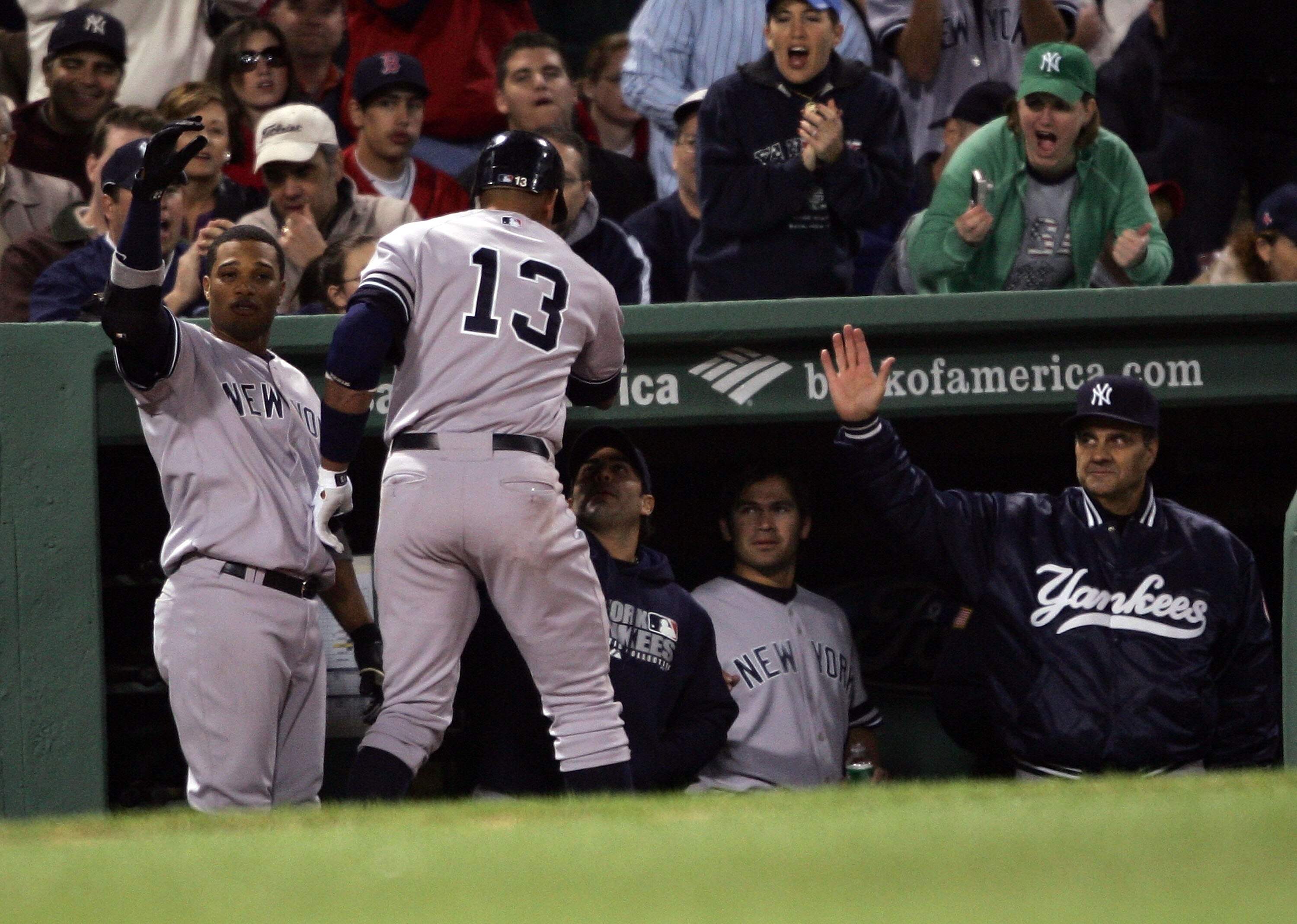 BOSTON - APRIL 20:  Alex Rodriguez #13 of the New York Yankees is congratulated by teammates and manager Joe Torre#6 after Rodriguez hit a solo home run in the fourth inning against the Boston Red Sox on April 20, 2007 at Fenway Park in Boston, Massachuse